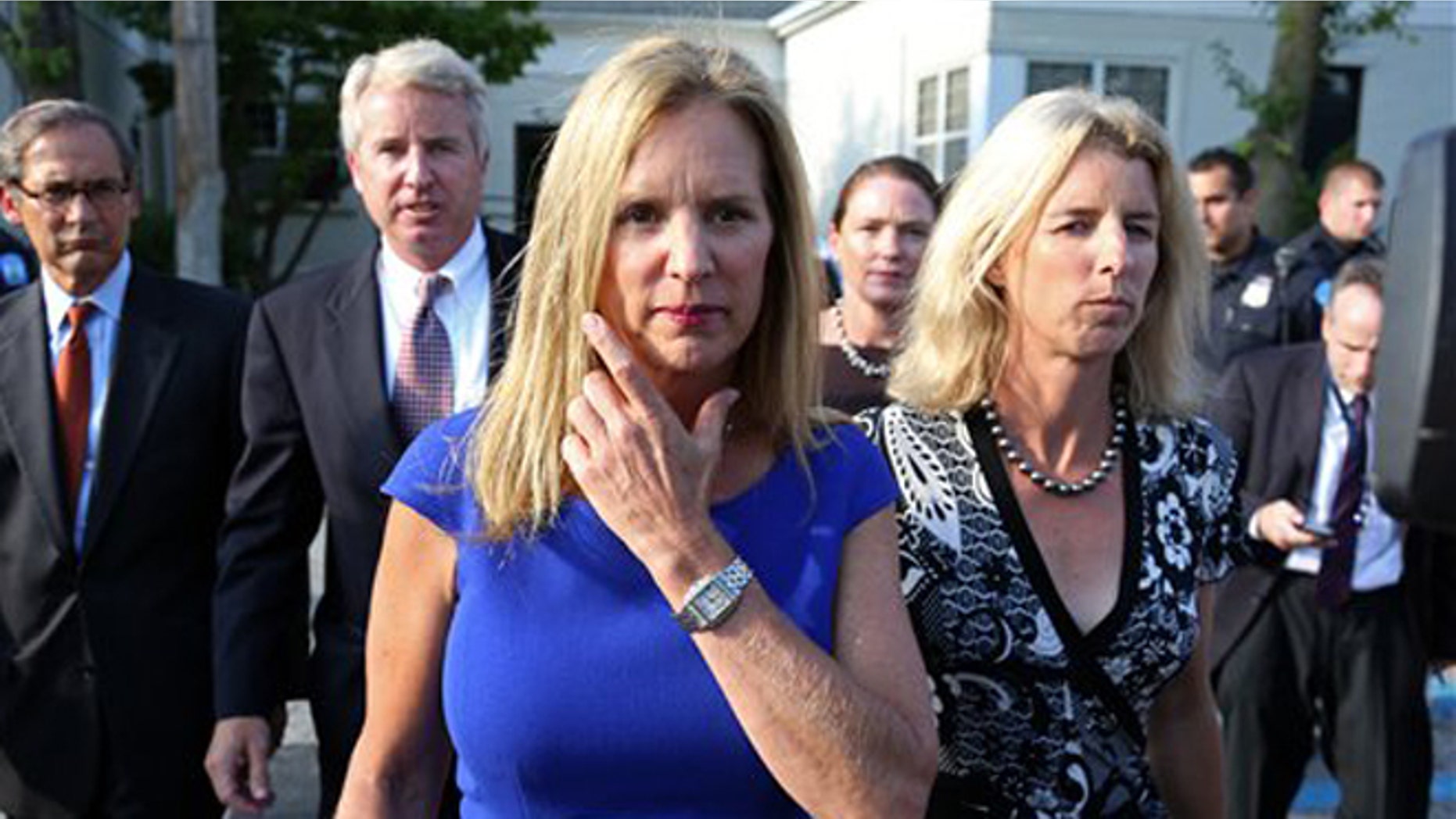 July 17, 2012: Kerry Kennedy, ex-wife of New York Gov. Andrew Cuomo, flanked by her brother Christopher Kennedy, center left, and sister Rory Kennedy, right, walks from the North Castle Justice Court in Armonk, N.Y.