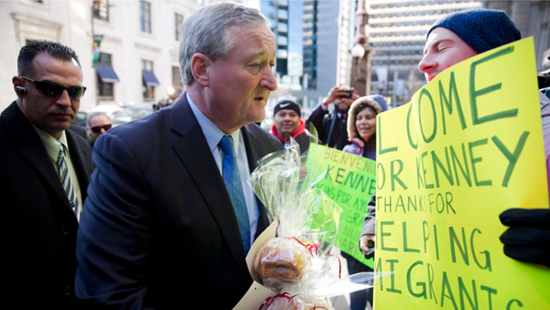 Newly sworn in Philadelphia Mayor Jim Kenney greets immigration advocates after his inauguration Monday, Jan. 4, 2016, in Philadelphia. The 57-year-old Kenney succeeds Michael Nutter, who leaves office after two terms. Kenney served on city council for more than two decades before he was elected in November. (AP Photo/Matt Rourke)