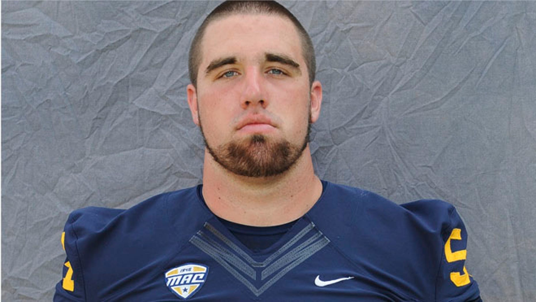 Aug. 2014: Jason Bitsko poses during football photo day in Kent, Ohio.