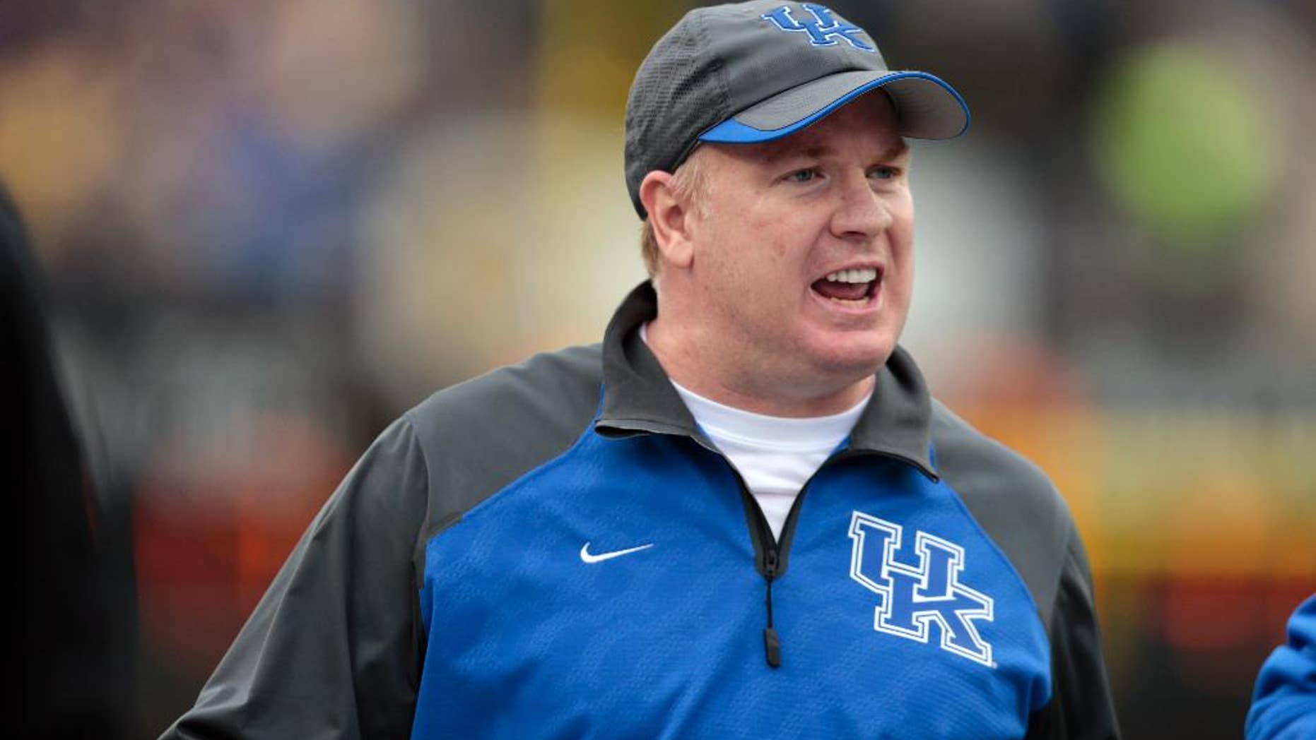 FILE - In this Nov. 16, 2013 file photo, Kentucky head coach Mark Stoops watches from the sideline in the second quarter of an NCAA college football game against Vanderbilt in Nashville, Tenn. Stoops begins fall practice on Monday, Aug. 4, 2014, seeking progress in his second season. He's encouraged by the Wildcats' attitude and improved grasp of the system and believes that can end a string of consecutive 2-10 finishes.(AP Photo/Mark Humphrey, File)