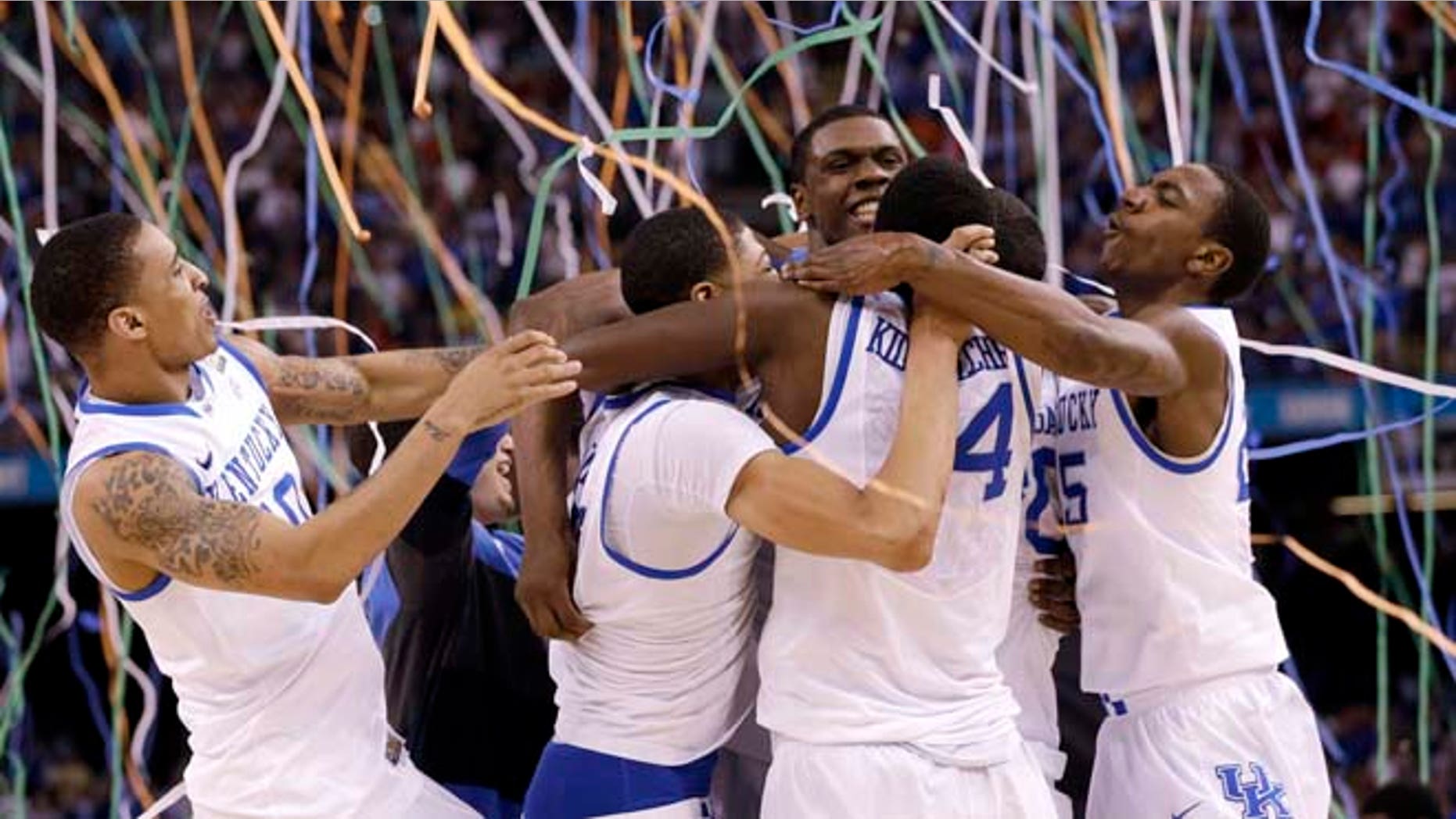 Kentucky players celebrate at the end of the NCAA Final Four tournament college basketball championship game against Kansas Monday, April 2, 2012, in New Orleans. Kentucky won 67-59. (AP Photo/David J. Phillip)