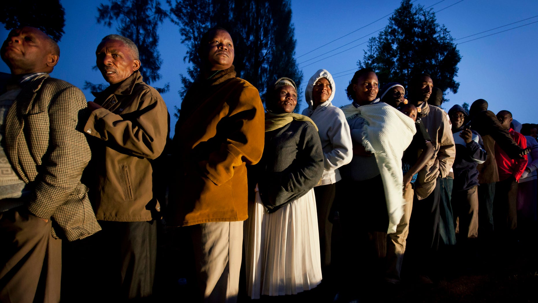 March 4, 2013 - Kenyans line up to cast their vote in the early morning north of Nairobi, Kenya.