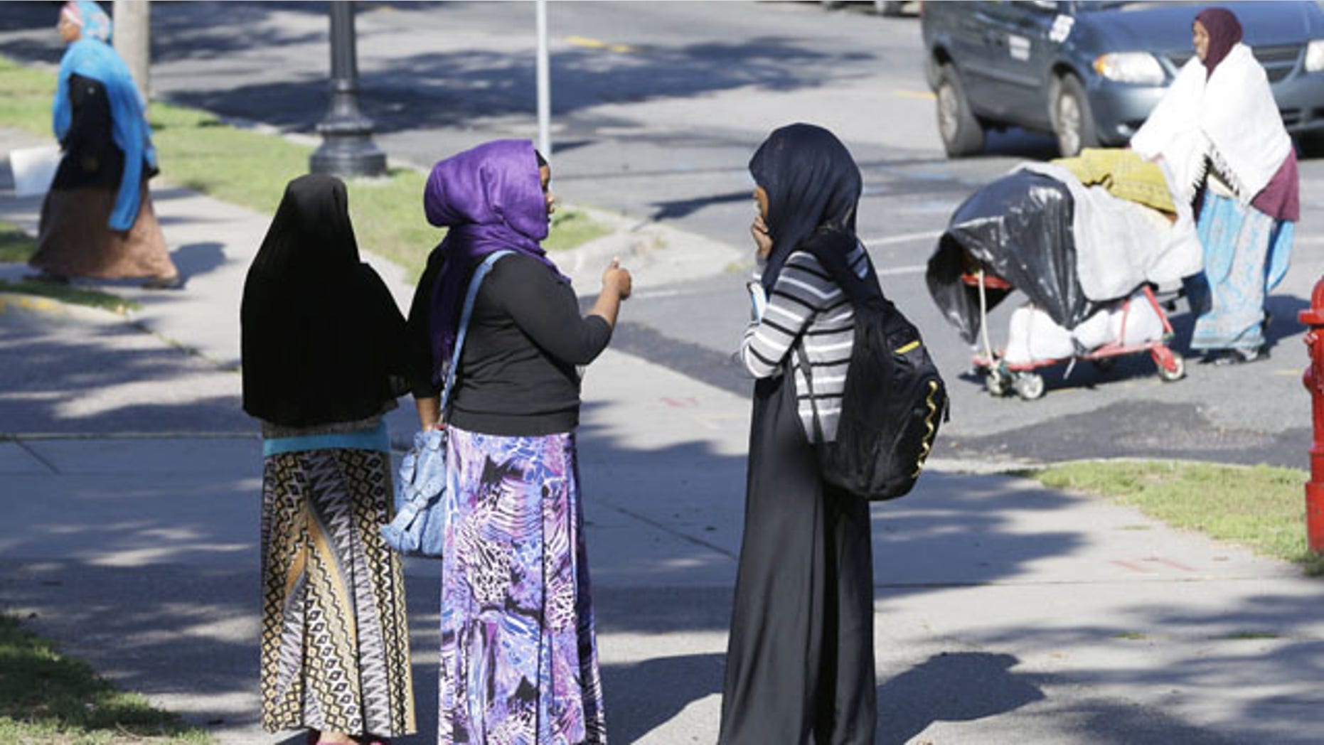 September 24, 2013: Members of the Somali community visit near a park in Minneapolis. It's been six years since Minnesota first began furnishing young fighters to al-Shabab, the terror group that has claimed responsibility for the deadly mall attack in Kenya. (AP Photo)