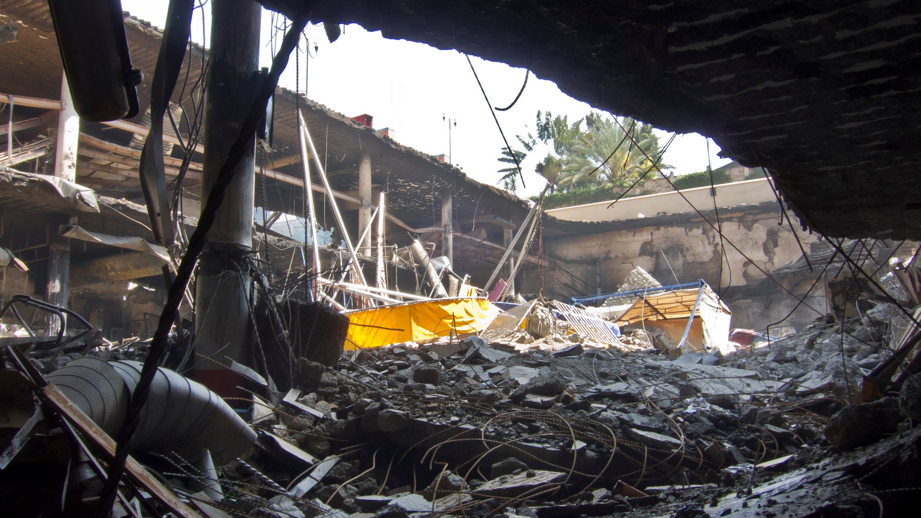 Sept. 28, 2013 - Rubble from the collapsed upper car park level covers buried vehicles in the basement car park, at the Westgate Mall in Nairobi, Kenya.