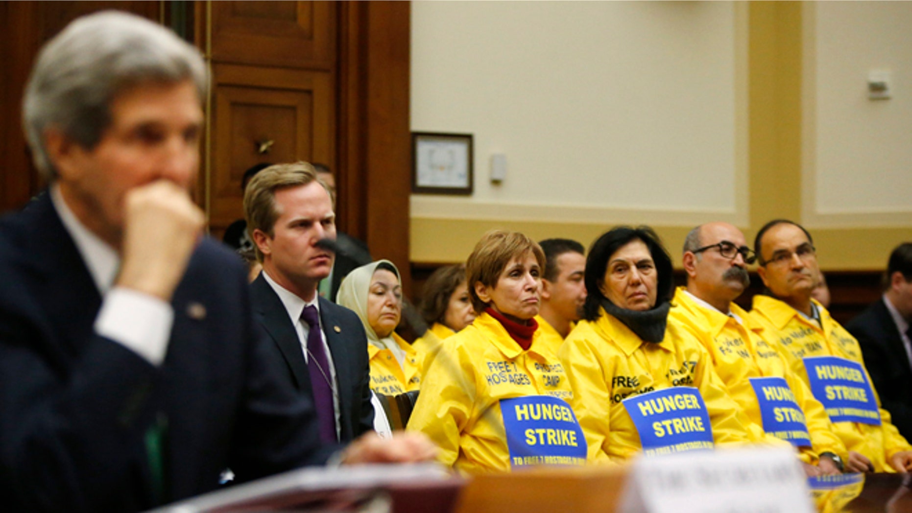 FILE: Dec. 10, 2013: Families of Iranian dissidents and Secretary of State John Kerry on Capitol Hill about Iran's nuclear programs, Washington, D.C.