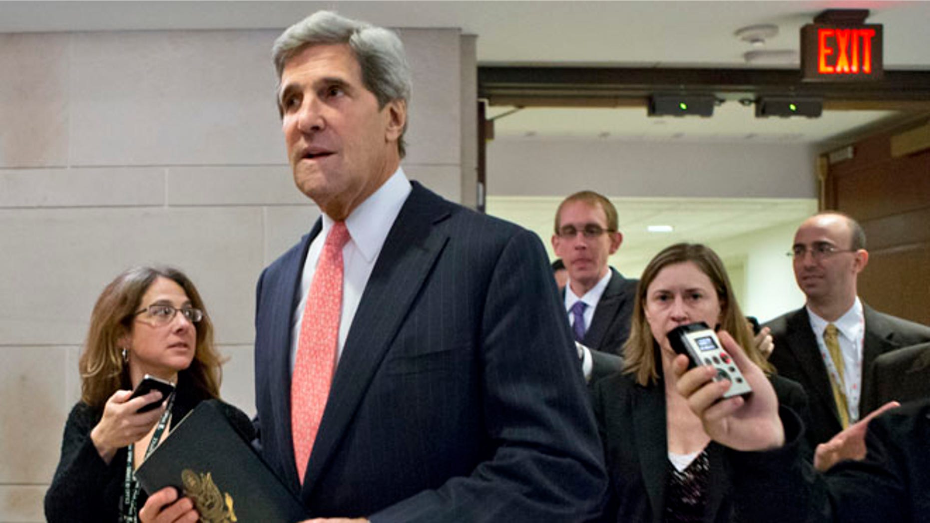 FILE: Nov. 13, 2012: Senate Foreign Relations Committee Chairman Sen. John Kerry, D-Mass., arriving for a meeting on Capitol Hill in Washington.