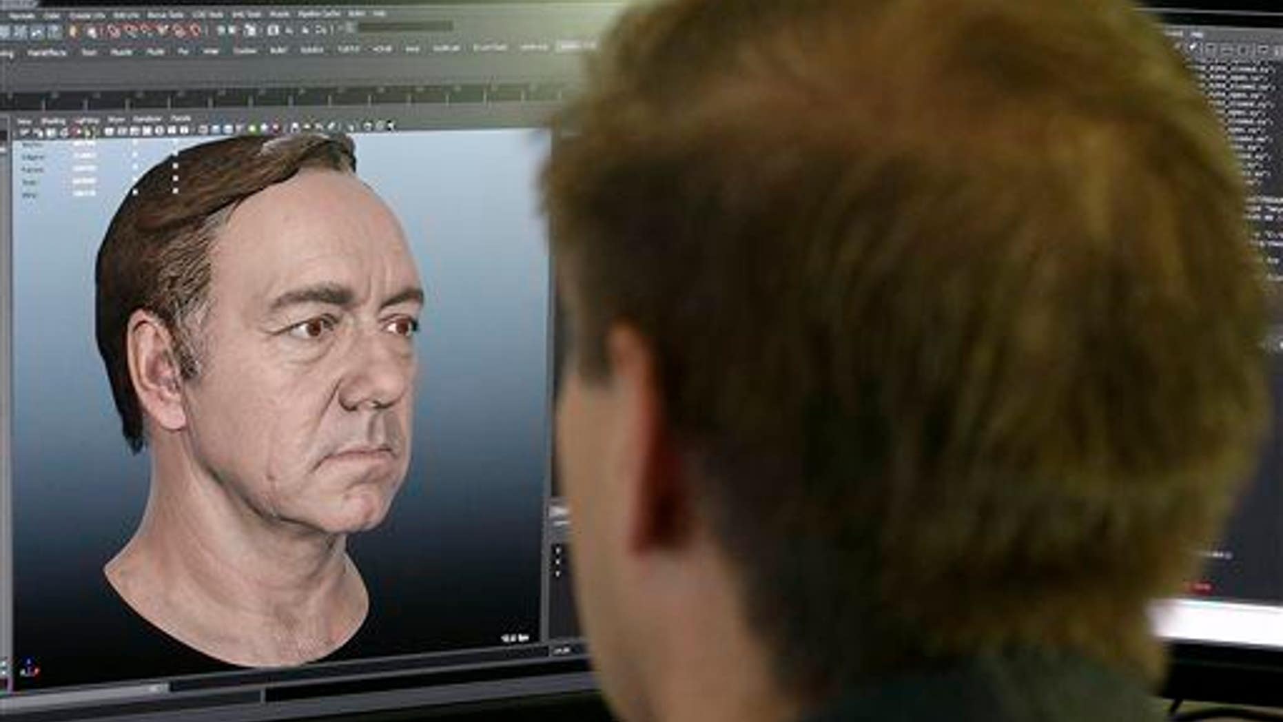 This July 31, 2014, photo shows a senior technical artist working on the face of actor Kevin Spacey for the new "Call of Duty: Advanced Warfare" game at Sledgehammer Games in Foster City, Calif.