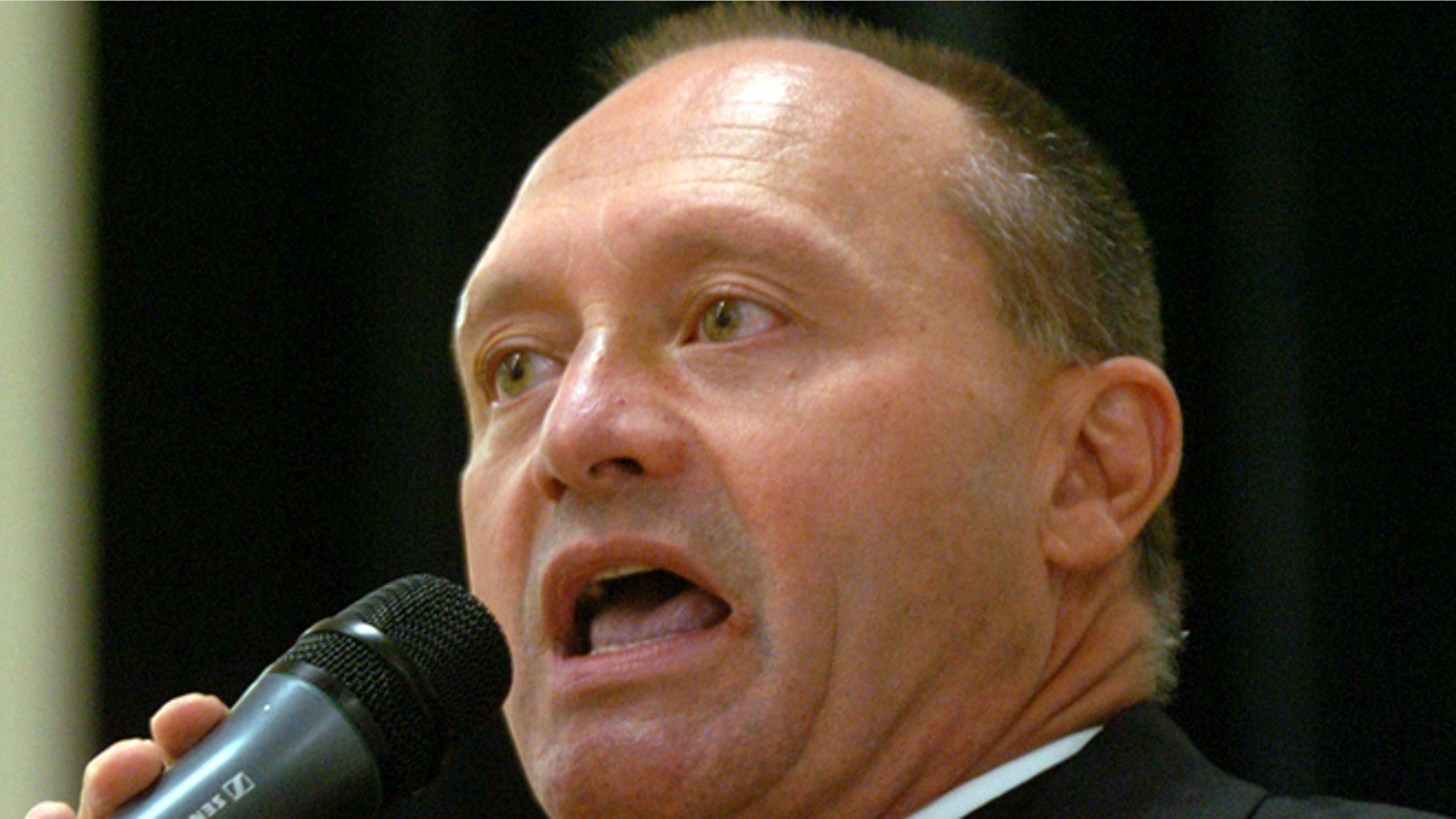 In this May 4, 2006 photo, Monsignor Kevin Wallin speaks at the Catholic Center, headquarters of the Diocese of Bridgeport, in Bridgeport, Conn. Wallin, of Waterbury, Conn., awaits a March 2013 trial on federal charges of shipping methamphetamine from California to his apartment and making more than $300,000 in drug sales in the second half of 2012.