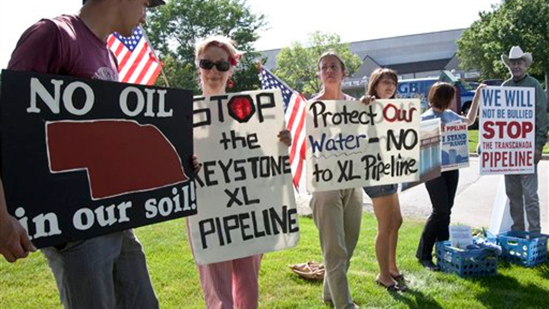 July 26: Protestors opposed to the Keystone XL pipeline hold signs outside the office of Rep. Lee Terry, R-Neb., in Omaha, Neb.