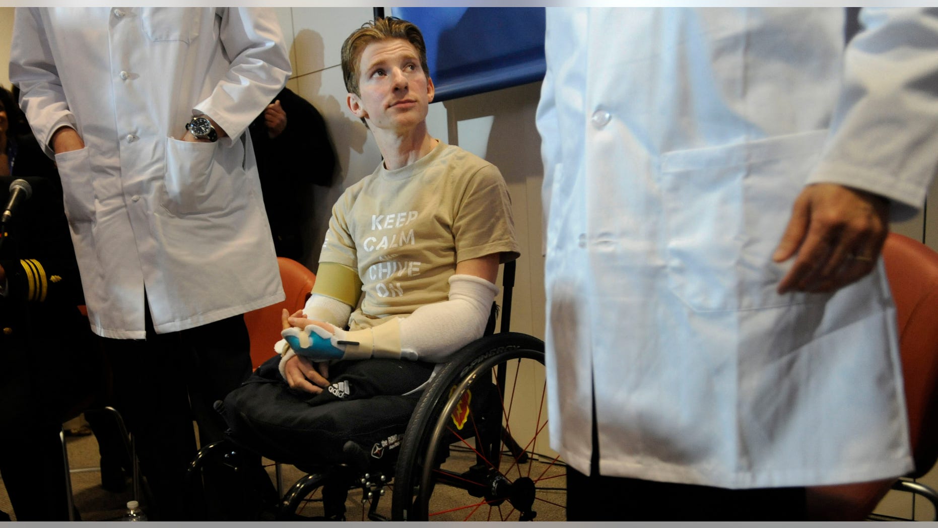 In this Tuesday, Jan. 29. 2013, photo, retired Infantryman Brendan M. Marrocco participates in a news conference at Johns Hopkins hospital in Baltimore. Marrocco received a transplant of two arms from a deceased donor after losing all four limbs in a 2009 roadside bomb attack in Iraq.
