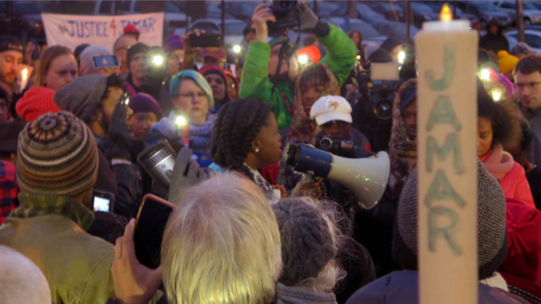 File- This Nov. 20, 2015, file photo shows Minneapolis NAACP leader Nekima Levy-Pounds speaking at a prayer vigil. Five people were shot near the site of an ongoing protest over the fatal shooting of a black man by a police officer, a Minneapolis Police Department spokesman said. (AP Photo/Greg Moore, File)