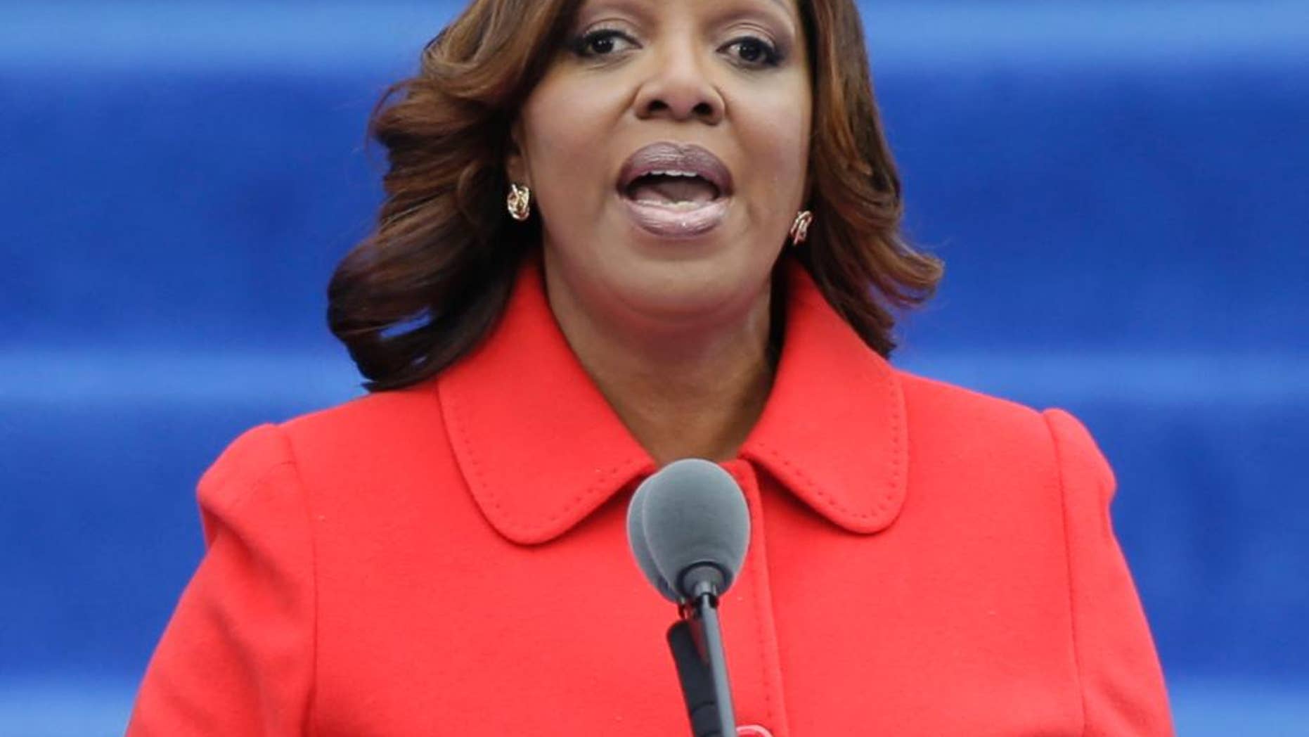 File-This Jan. 1, 2014, file photo shows New York Public Advocate Letitia James speaking after taking the oath of office in on the steps of City Hall in New York. James is pressing for appointing special state prosecutors whenever police kill or seriously injure someone. State Assemblymen Karim Camara and Marcos Crespo are proposing special prosecutors for police killings of unarmed people. (AP Photo/Frank Franklin II, File)