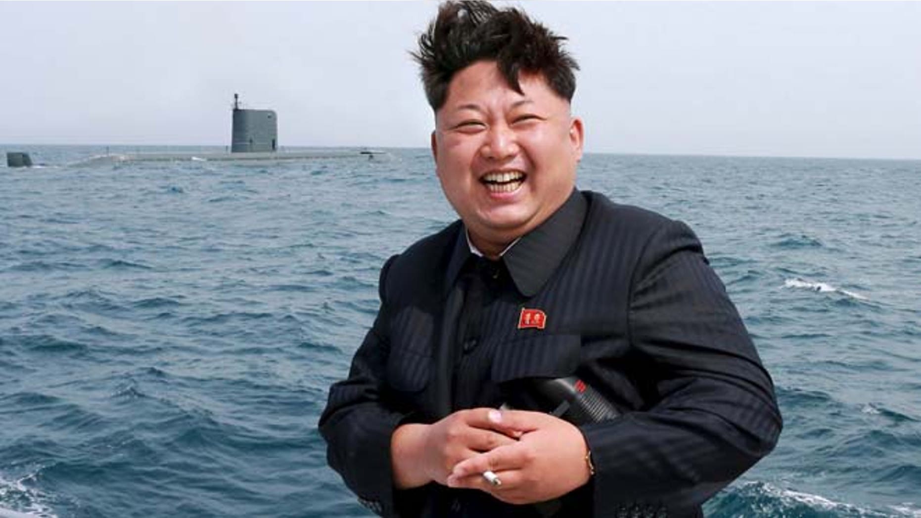 May 9: North Korean leader Kim Jong Un watches the test-fire of a strategic submarine underwater ballistic missile (not pictured), in this undated photo released by North Korea's Korean Central News Agency in Pyongyang.