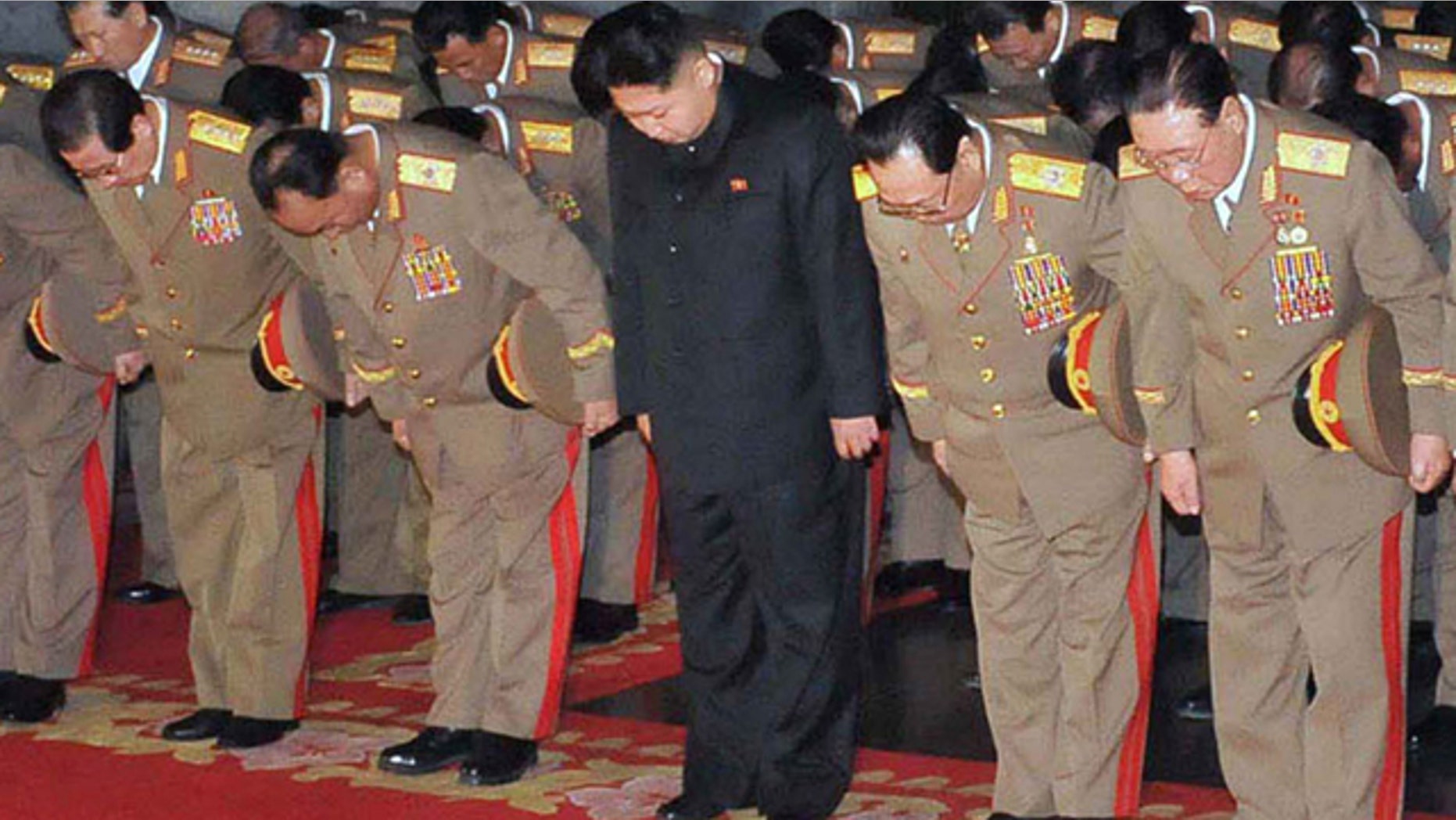 Dec. 24, 2011: This photo released by the Korean Central News Agency and distributed by the Korea News Service, shows Kim Jong Un, center.