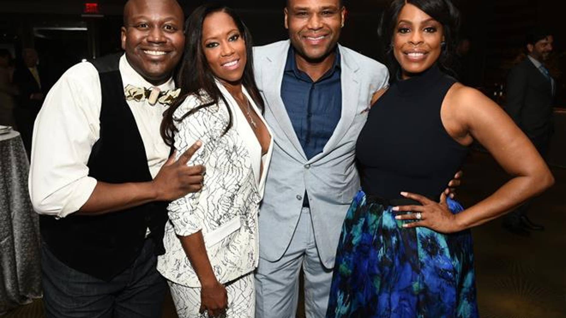 Titus Burgess, from left, Regina King, Anthony Anderson, and Niecy Nash attend the Television Academy's 67th Emmy Awards Performers Nominee Reception in 2015.