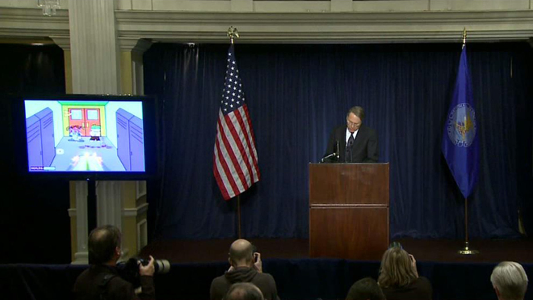 Dec. 22, 2012: Citing violent video games such as "Kindergarten Killers," seen on a screen over his shoulder, NRA chief Wayne LaPierre addresses the nation following a massacre in Connecticut.