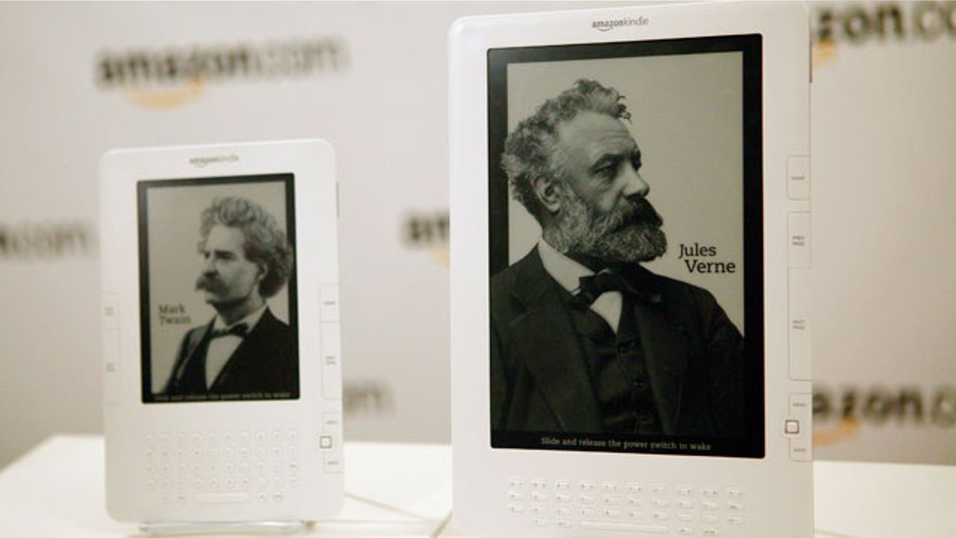 Two models of the Amazon Kindle stand side by side on display.