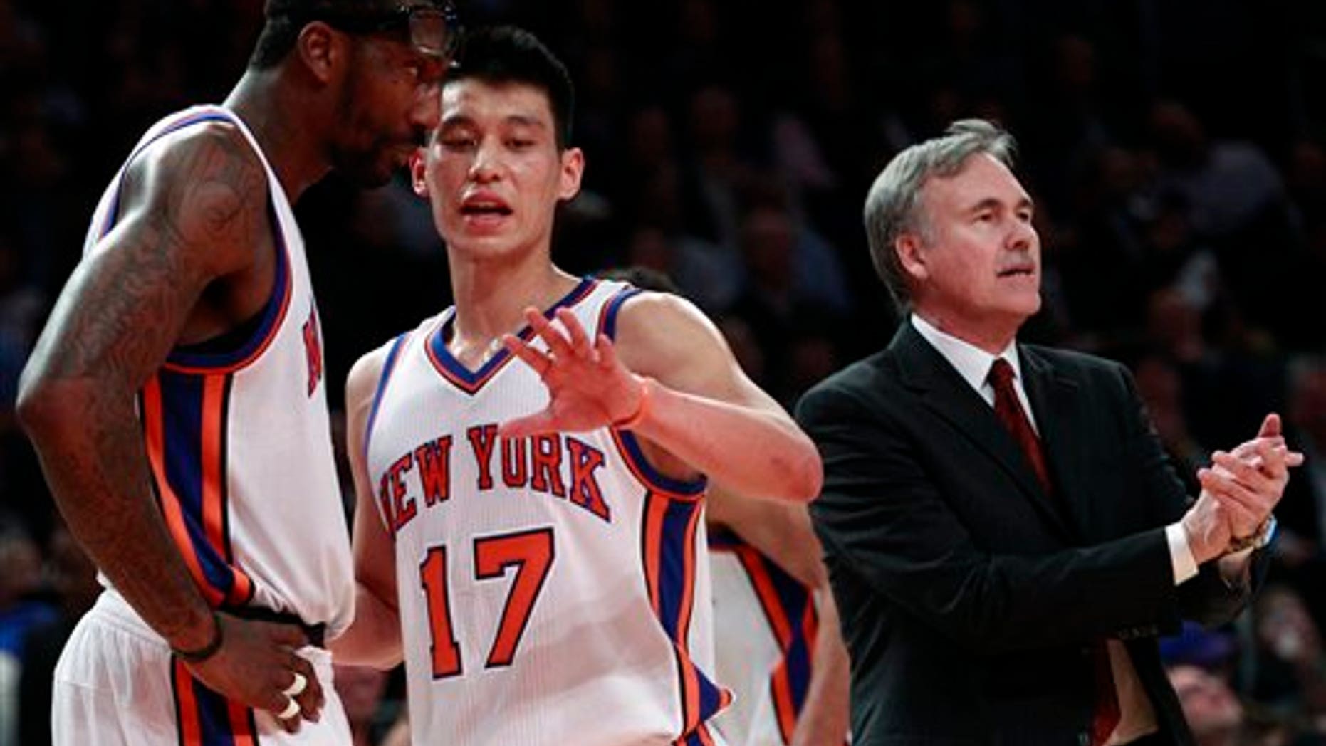 Feb. 15: New York Knicks' Jeremy Lin (17) talks to teammate Amare Stoudemire (1) as head coach Mike D'Antoni calls out to the team during the first half of an NBA basketball game against the Sacramento Kings.