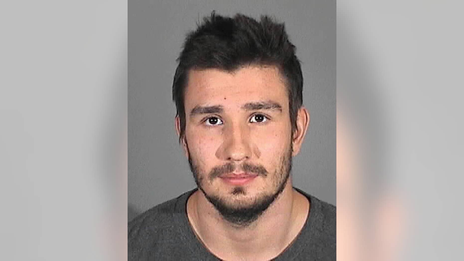 This Monday, Oct. 20, 2014 police booking photo provided by the Redondo Beach Police Department shows Los Angeles Kings' defenseman Slava Voynov. The NHL suspended Voynov indefinitely Monday, after the two-time Stanley Cup winner's arrest on suspicion of domestic violence. The 24-year-old posted $50,000 bail. (AP Photo/Redondo Beach Police Department)