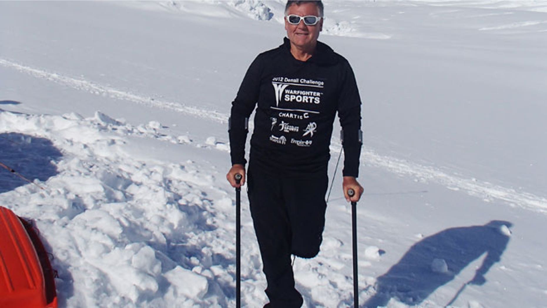 In this June 13, 2012 photo released by Disabled Sports USA, shows Kirk Bauer, 64, a climber and executive director of Disabled Sports USA, poses in front of Mount McKinley, Alaska.