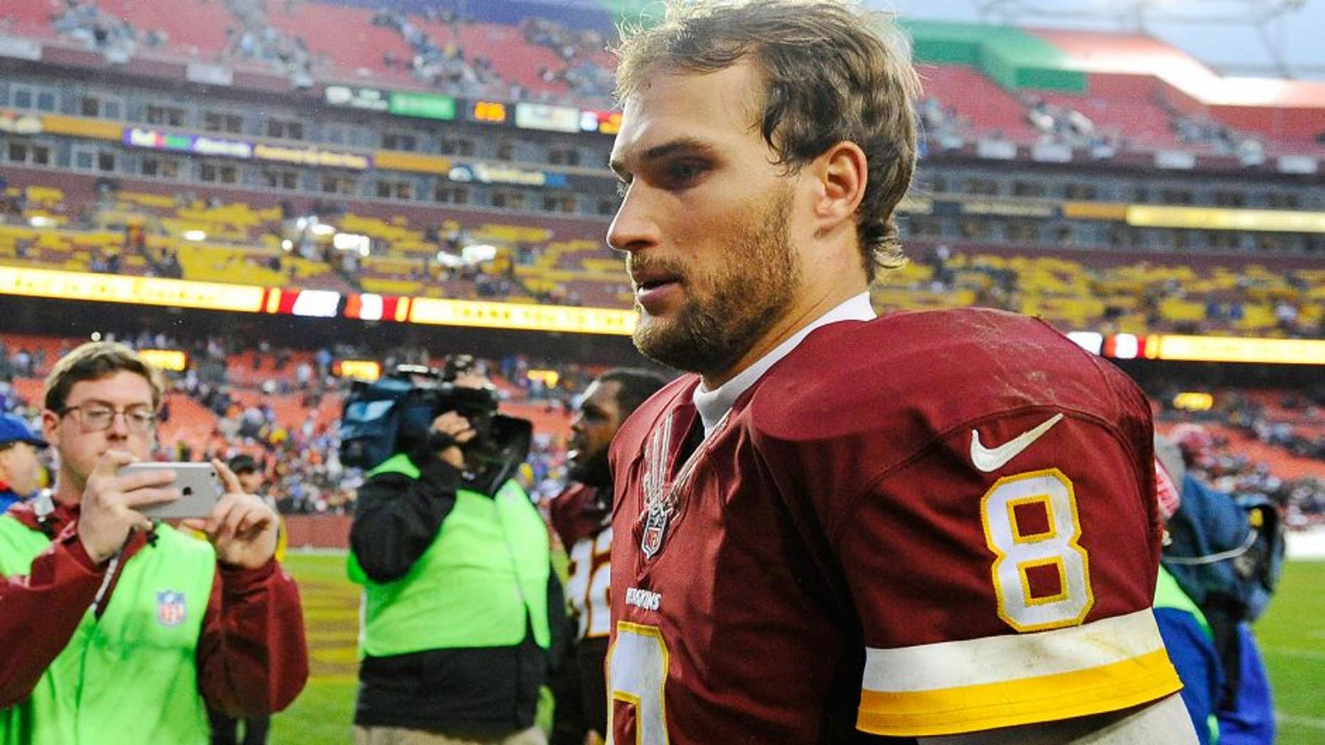 Nov 29, 2015; Landover, MD, USA; Washington Redskins quarterback Kirk Cousins (8) walks of the field after the game against the New York Giants at FedEx Field. The Redskins won 20-14. Mandatory Credit: Brad Mills-USA TODAY Sports