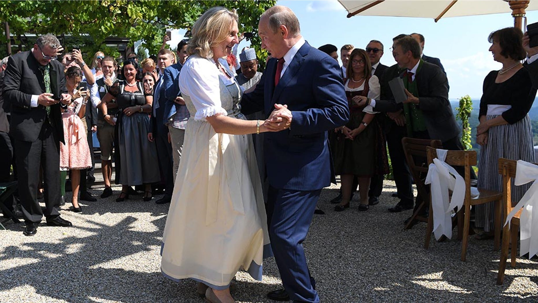 Austria's Foreign Minister Karin Kneissl dances with Russia's President Vladimir Putin at her wedding in Gamlitz, Austria, August 18, 2018. Roland Schlager/Pool via Reuters