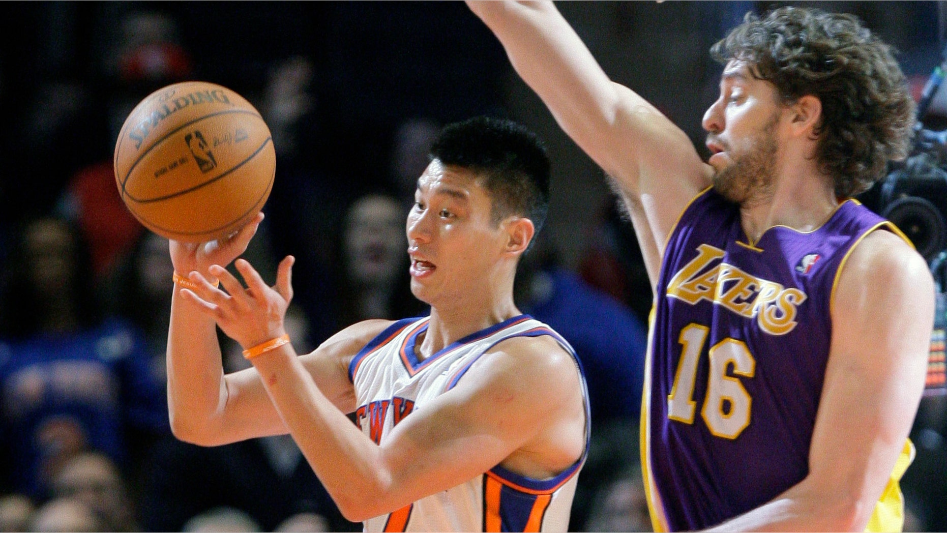 New York Knicks' Jeremy Lin (17) passes away from Los Angeles Lakers' Pau Gasol (16), of Spain, during the second half of an NBA basketball game Friday, Feb. 10, 2012, in New York. The Knicks won the game 92-85. (AP Photo/Frank Franklin II)