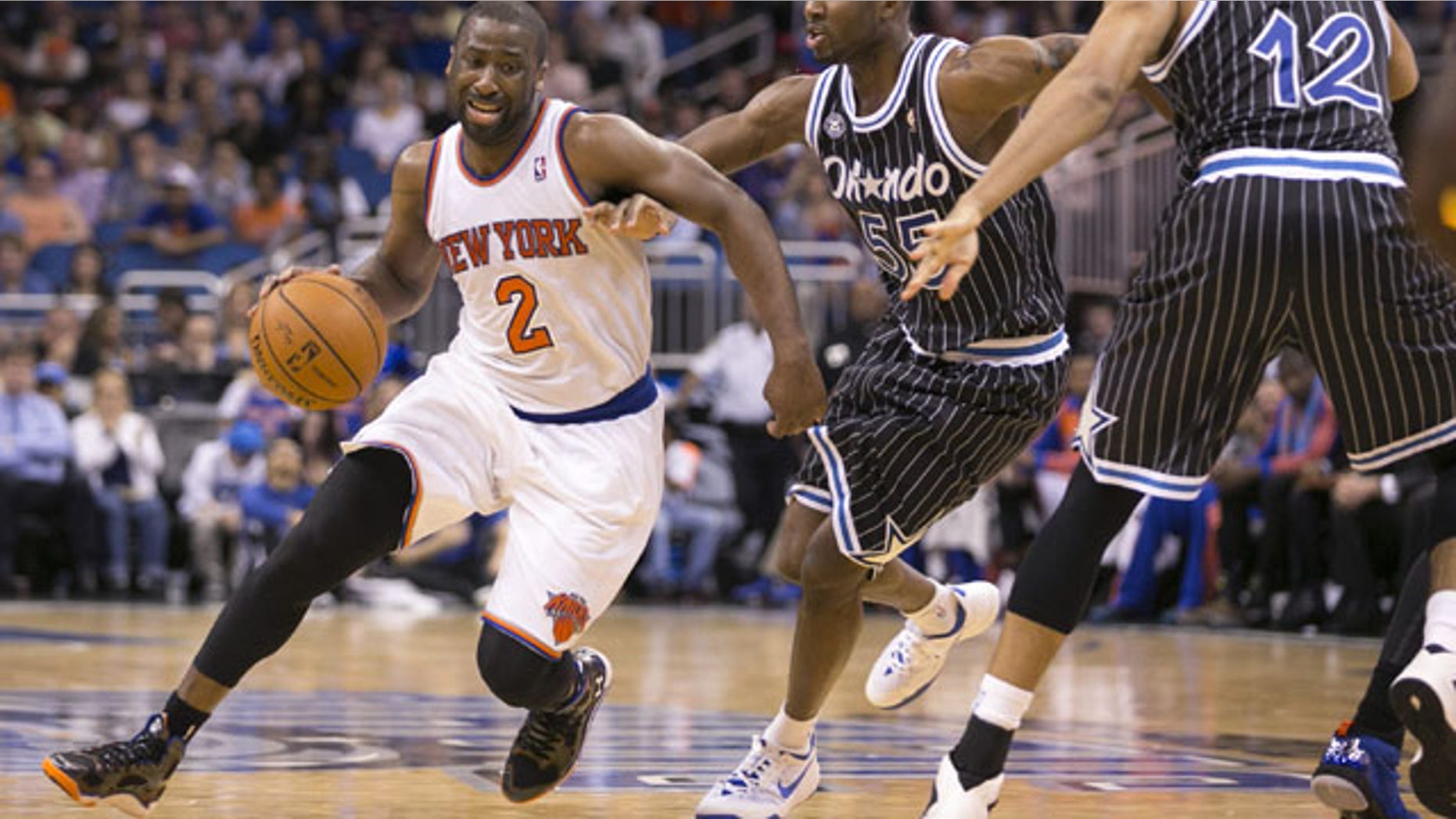 February 21, 2014: New York Knicks' Raymond Felton (2) dribbles around Orlando Magic's E'Twaun Moore (55) and Tobias Harris (12) during an NBA basketball game in Orlando, Fla. The Magic won 129-121 in two overtimes. (AP Photos/Willie J. Allen Jr.)