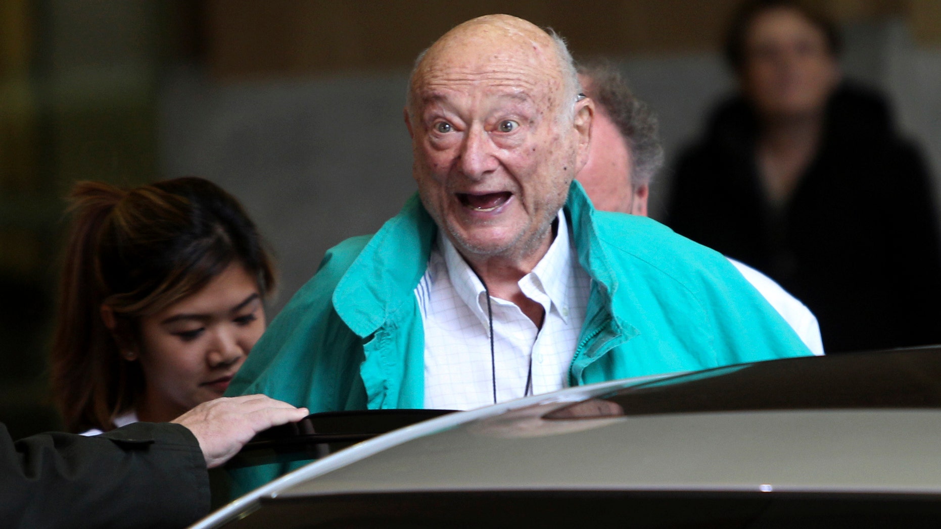 Dec. 10, 2012: In this file photo, former New York City Mayor Ed Koch says good-bye to reporters as he gets in his car after being released from the hospital in New York.