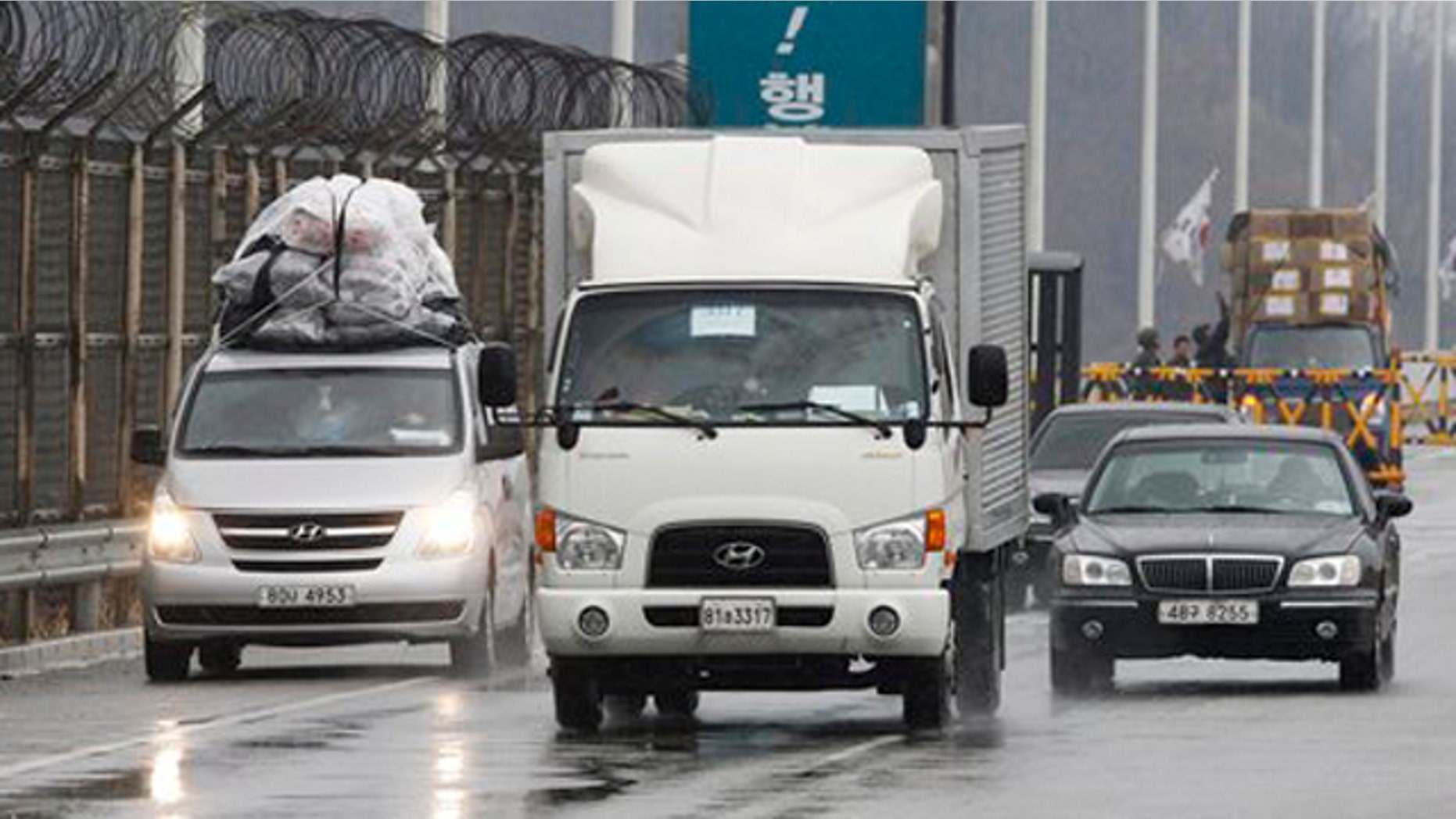 April 6, 2013: South Korean vehicles arrive back from the North Korean city of Kaesong at Unification Bridge in Paju, South Korea.