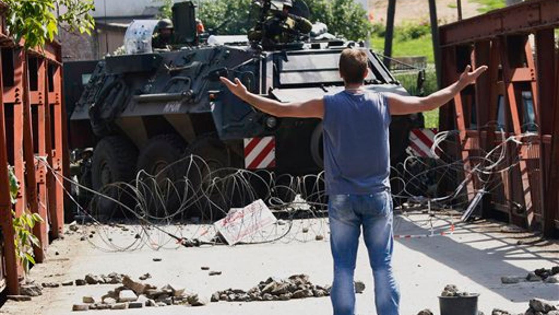 June 1, 2012: German army soldiers serving in the NATO peacekeeping mission in Kosovo guard a bridge near the town of Zvecan, Kosovo.