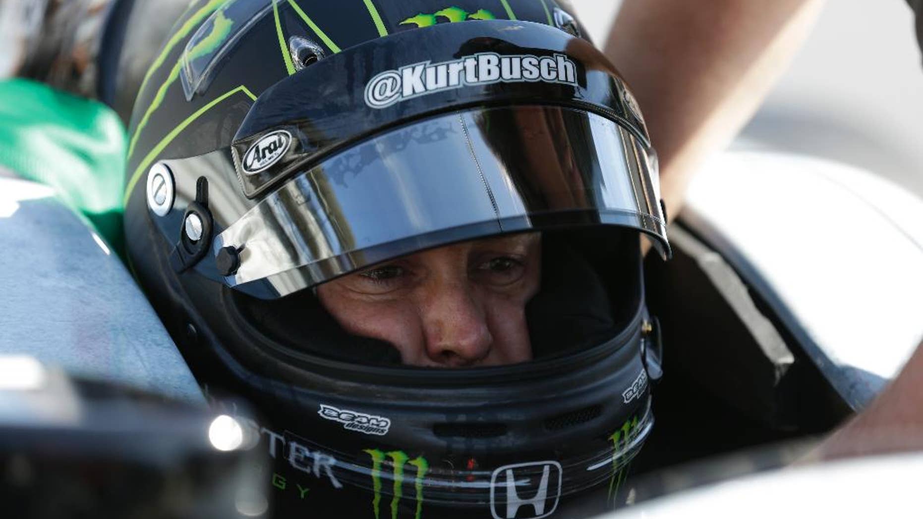 Race driver Kurt Busch practices at the Indianapolis Motor Speedway during the Rookie Orientation Program in Indianapolis, Tuesday, April 29, 2014. Busch will try to be the first driver in a decade to compete in IndyCar's Indianapolis 500 and Sprint Cup's Coca-Cola 600 on the same day. (AP Photo/Michael Conroy)