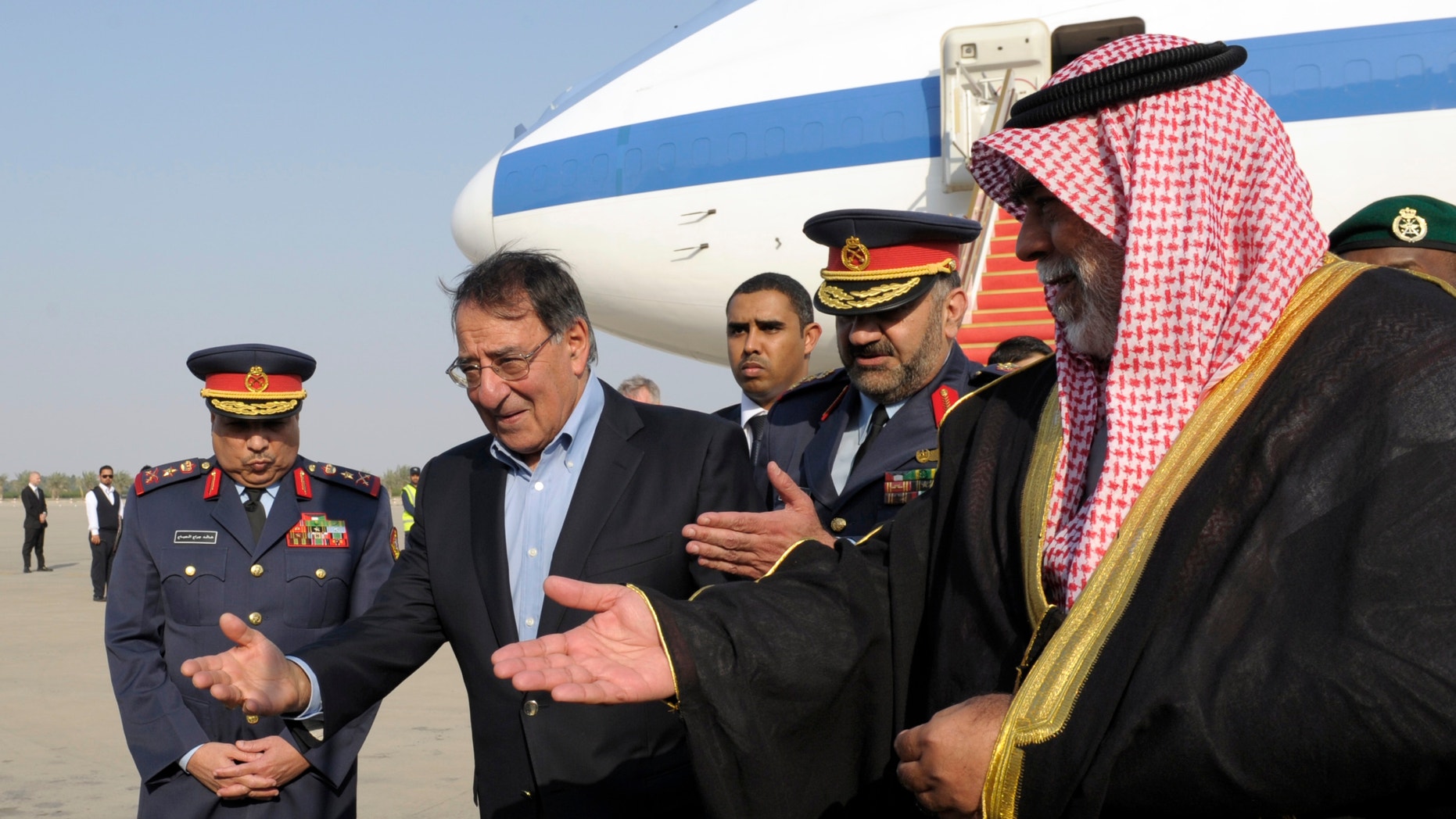 Dec. 11, 2012: U.S. Defense Secretary Leon Panetta, second from left, is welcomed upon his arrival at Kuwait International Airport in Kuwait City, Kuwait.