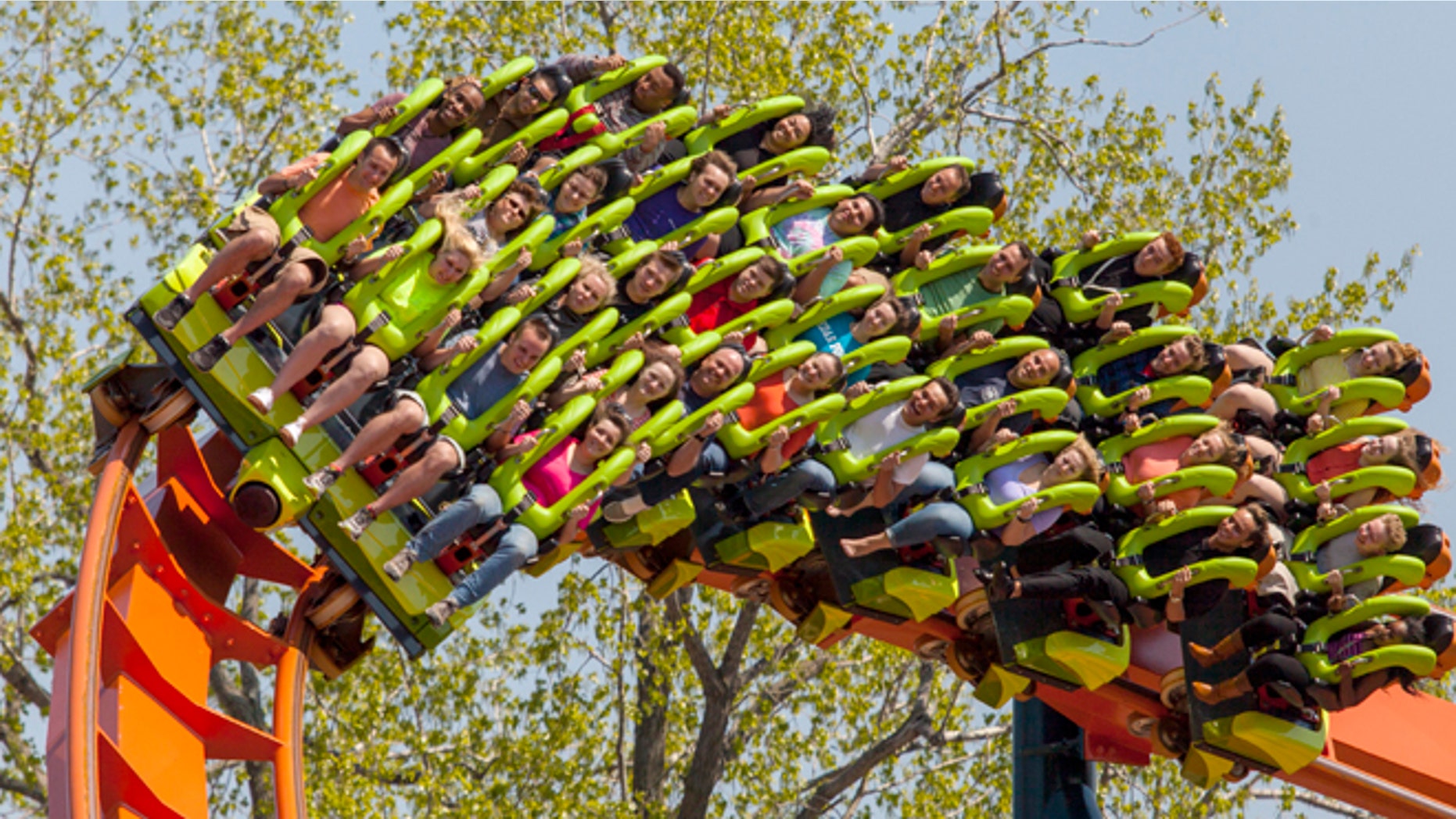 This photo provided by Cedar Point in Sandusky, Ohio, shows the theme parks new Rougarou roller coaster. The floorless coaster has a werewolf theme. Its one of a number of new attractions at theme parks around the country this summer. (AP Photo/Cedar Point)