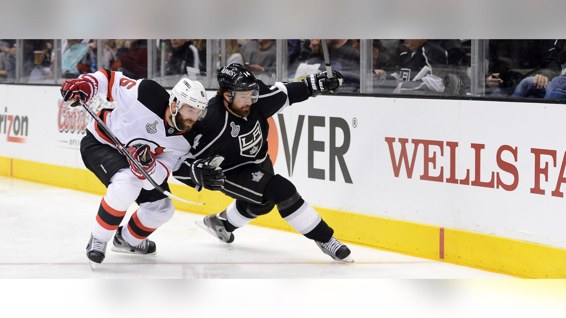 LAndy Greene #6 of the New Jersey Devils and Justin Williams #14 of the Los Angeles Kings vie for the puck. June 4, 2012 in Los Angeles, California. (Photo by Harry How/Getty Images)