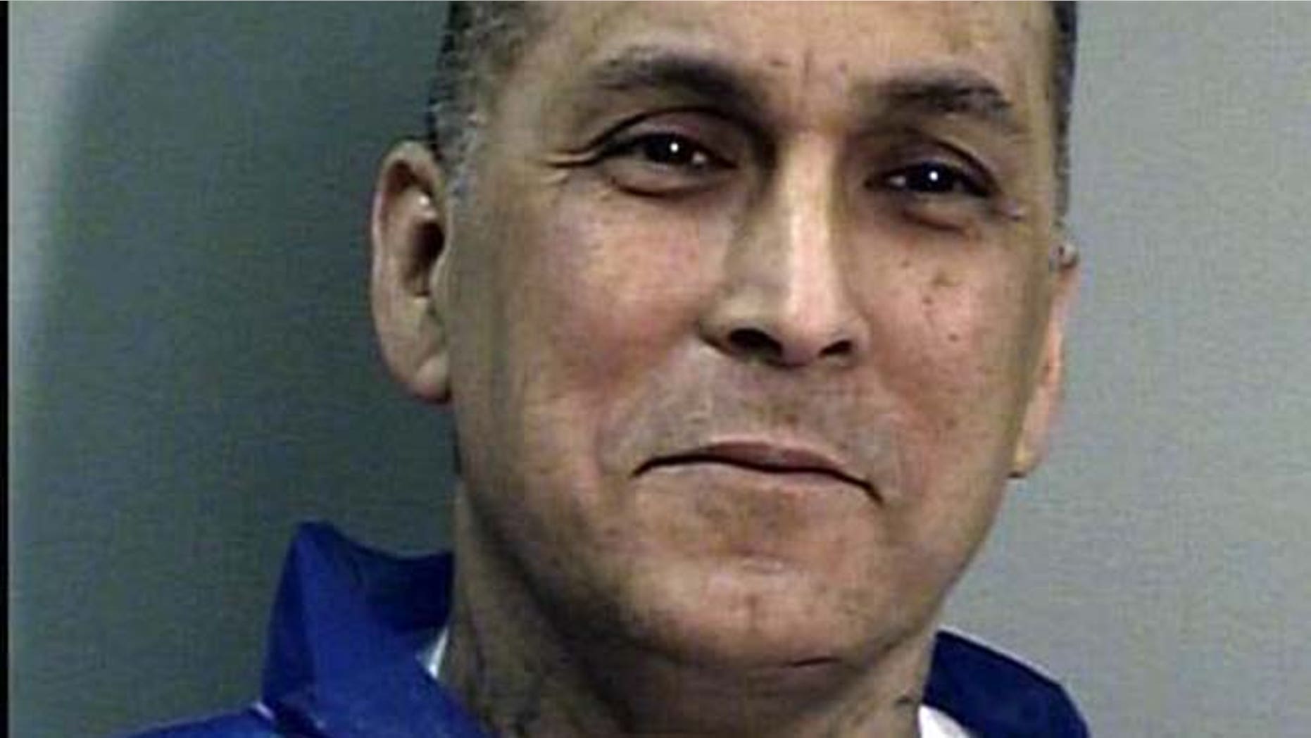 This undated file photo from the California Department of Corrections and Rehabilitation shows Rene "Boxer" Enriquez. The Los Angeles Police Department used an invalid court order and spent $22,000 to bring the imprisoned killer and former gang leader to speak to an exclusive dinner for private executives, according to a report released Friday.