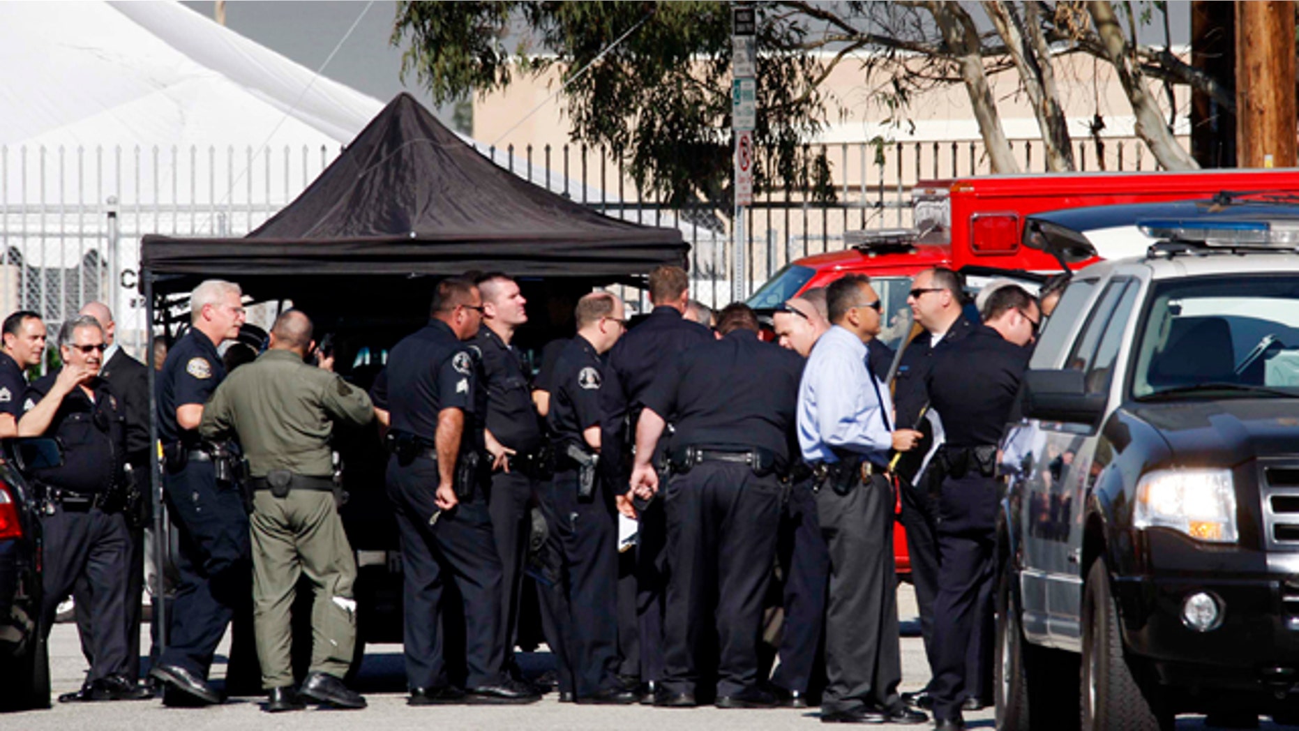 Jan. 18, 2011: Members of the LAPD gather outside Gardena High School in Gardena, Calif. According to officials, a number of students were wounded in a shooting at the school.