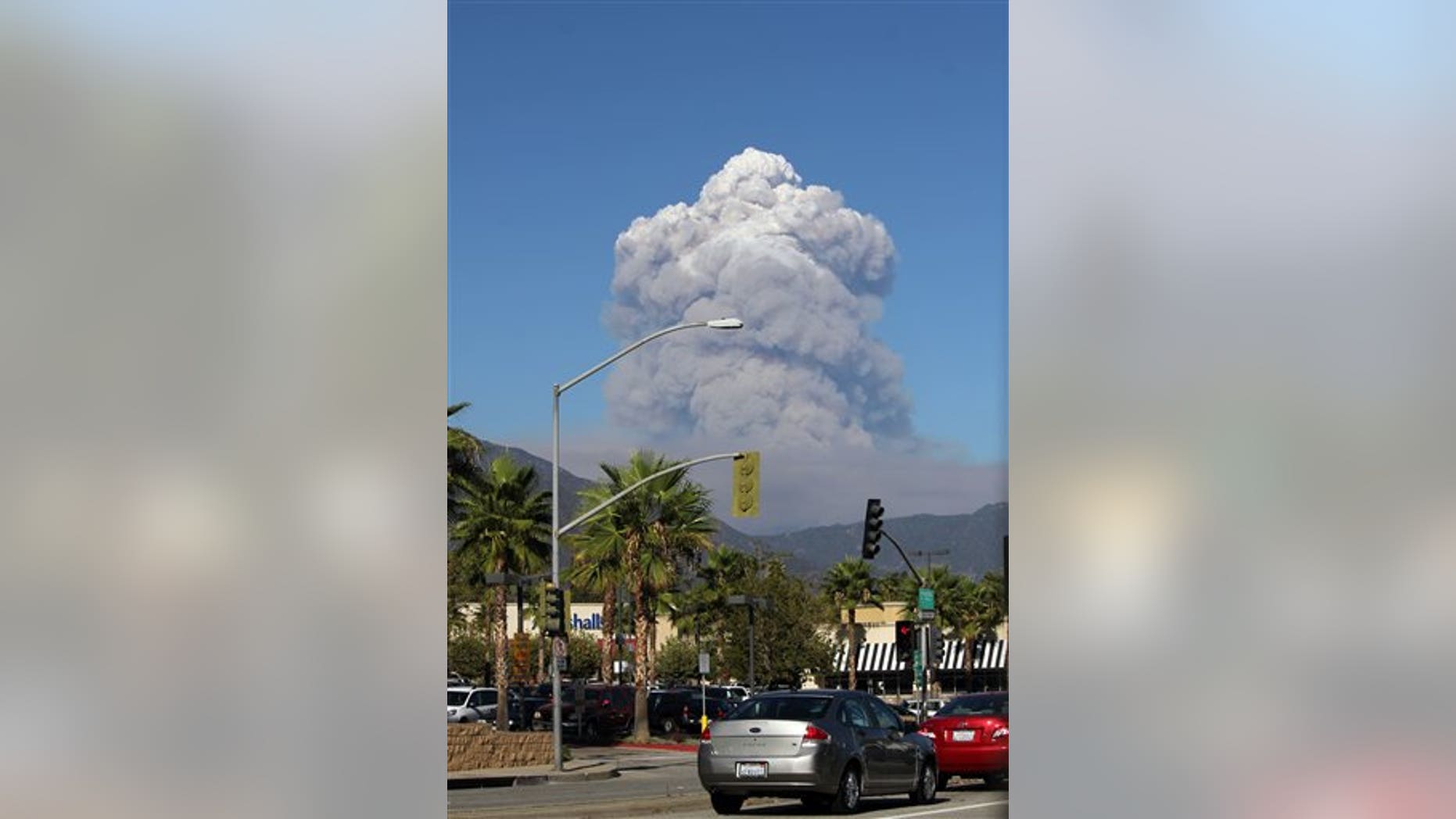 Sept, 2, 2012: A plume of smoke rises from the San Gabriel Canyon area of the Angeles National Forest in the San Gabriel Mountains northeast of Los Angeles.