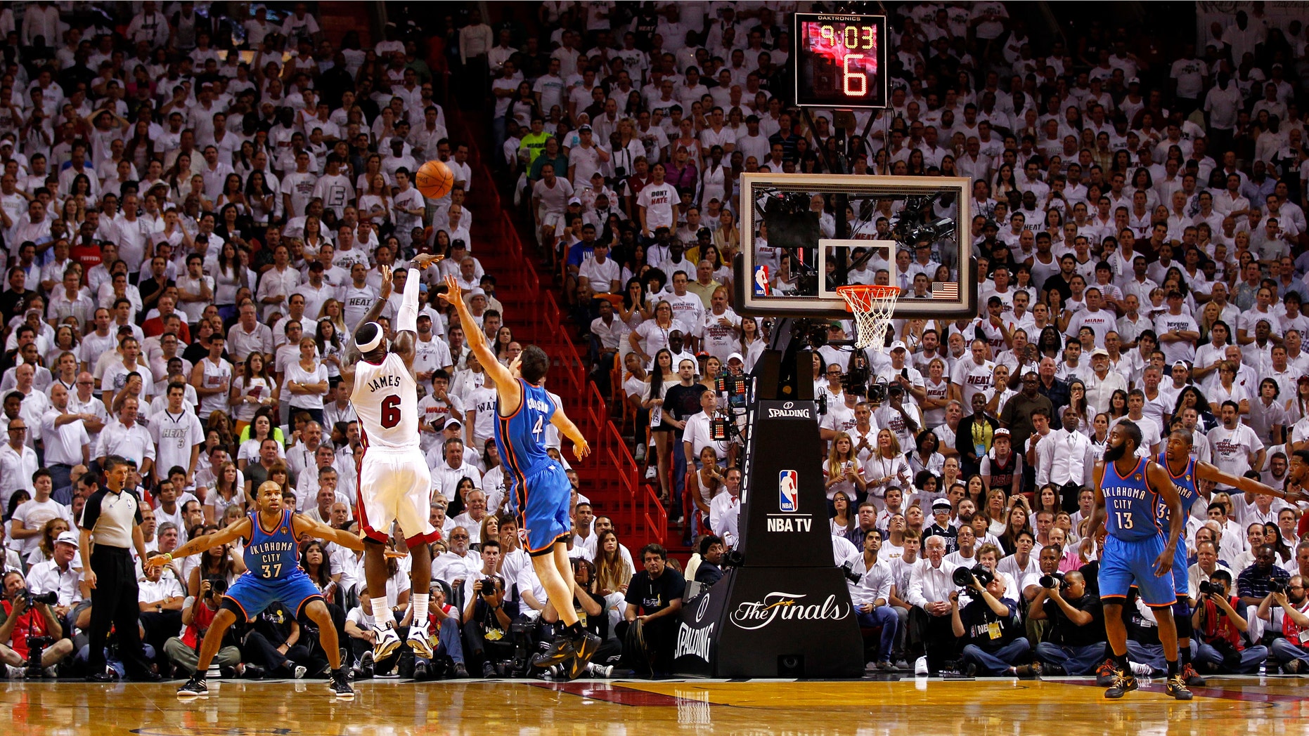 MIAMI, FL - JUNE 19: LeBron James #6 of the Miami Heat attempts a shot over Nick Collison #4 of the Oklahoma City Thunder in the second half of Game Four of the 2012 NBA Finals on June 19, 2012 at American Airlines Arena in Miami, Florida. NOTE TO USER: User expressly acknowledges and agrees that, by downloading and or using this photograph, User is consenting to the terms and conditions of the Getty Images License Agreement. (Photo by Mike Ehrmann/Getty Images)