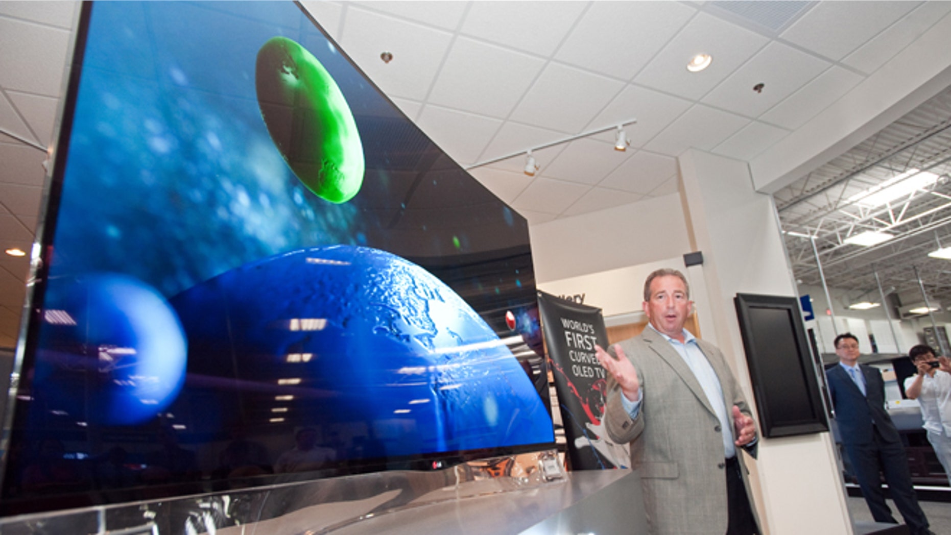 July 22, 2013: Tim Alessi, director of new product development LG Electronics USA, announces the first U.S. availability of LG's OLED HDTV on sale beginning today at the Magnolia Design Center in Best Buy.