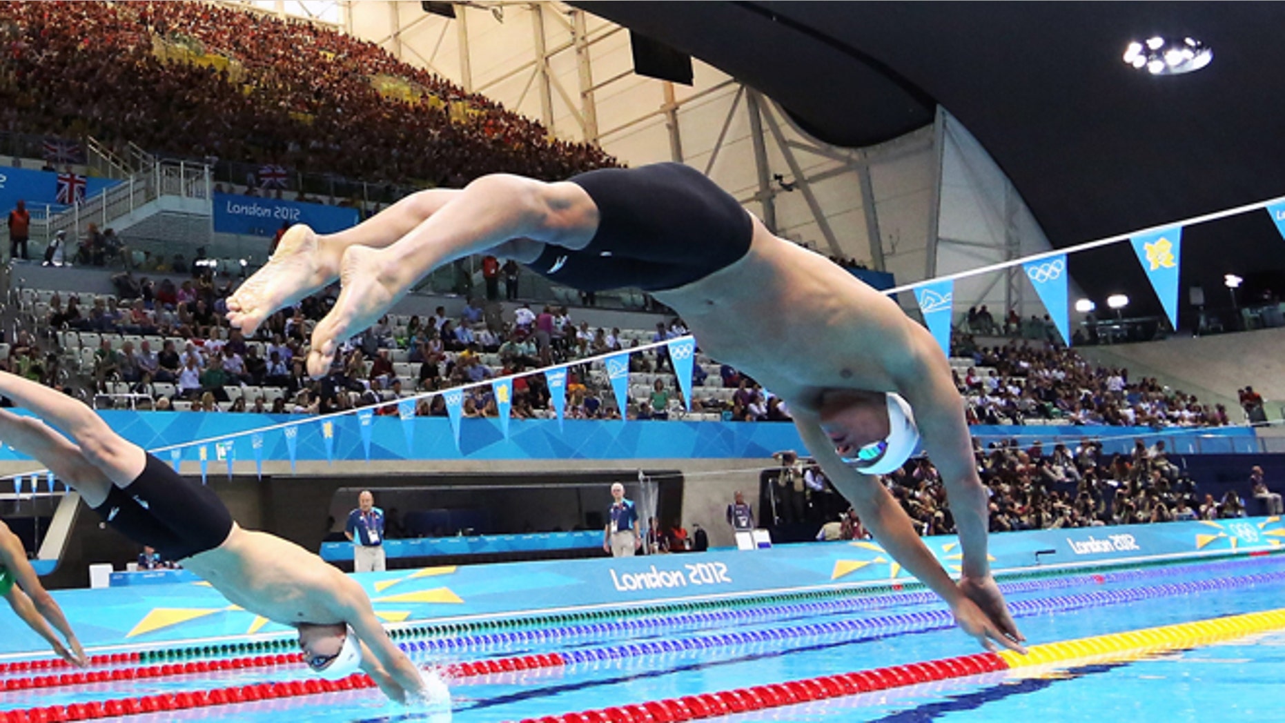 July 28, 2012: United States swimmer Ryan Lochte dives off of the starting block during the men's 400-meter individual medley event during the 2012 Summer Olympics at the Aquatics Centre in London.