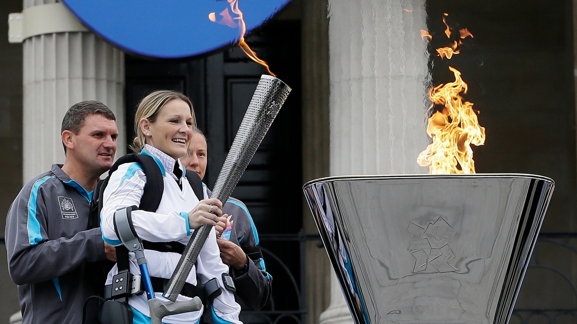 Aug. 24, 2012: Claire Lomas lights the Paralympic flame cauldron in Trafalgar Square in London.
