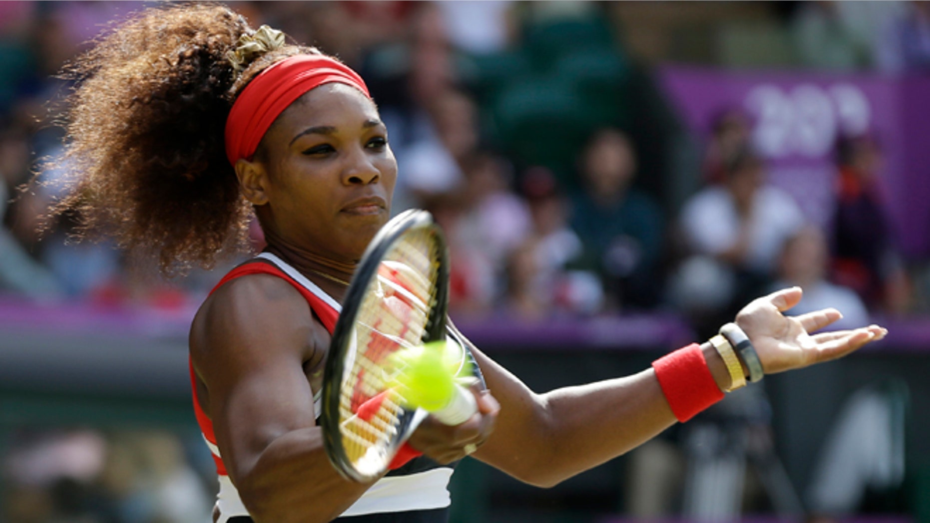 Aug. 4, 2012: United States' Serena Williams returns a shot to Maria Sharapova of Russia in the women's singles gold medal match at the All England Lawn Tennis Club at Wimbledon, in London, at the 2012 Summer Olympic.