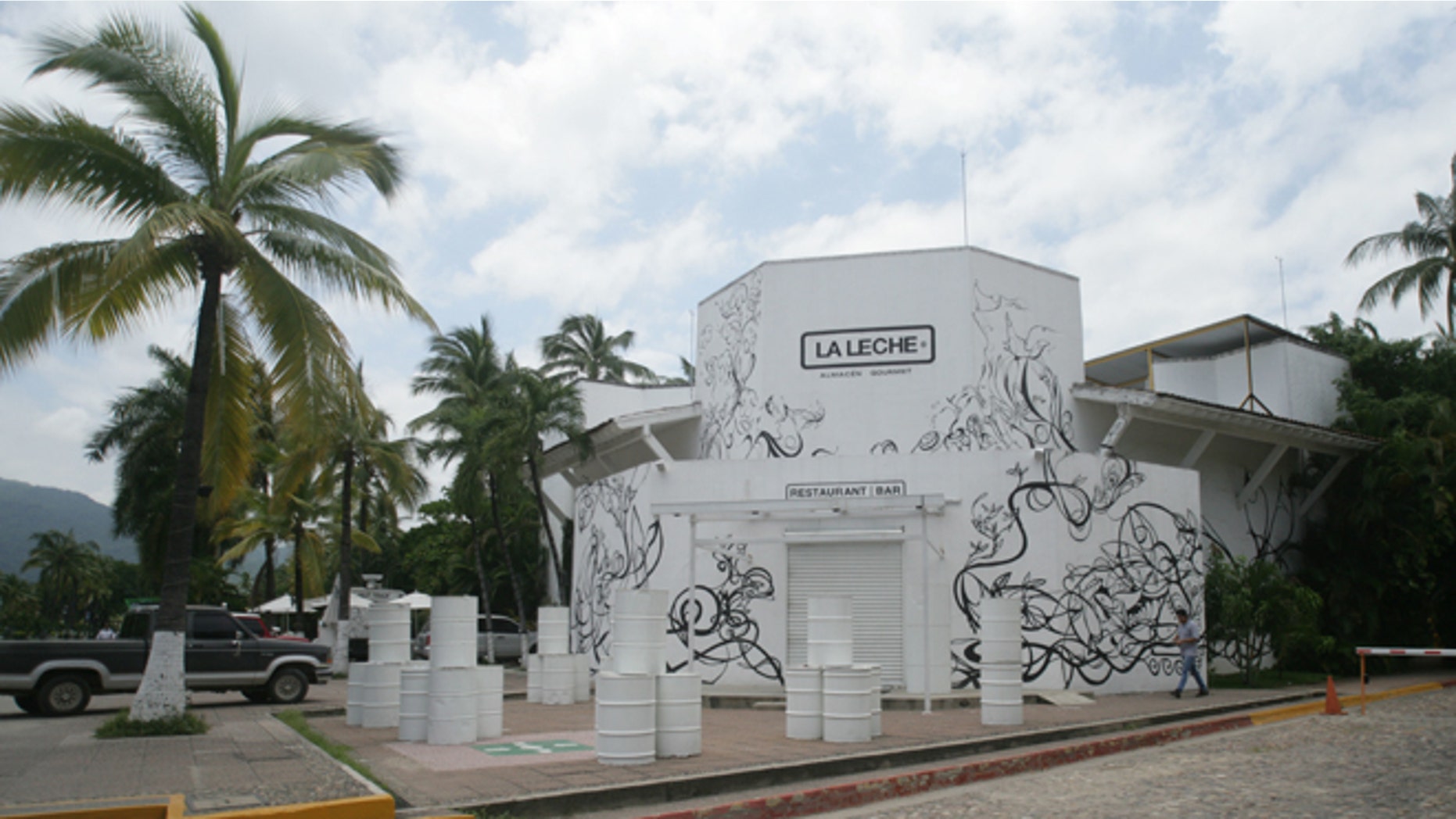The entrance of the restaurant "La Leche" stands closed after armed men abducted as many as 16 people who were dining in the upscale restaurant in Puerto Vallarta, Mexico, Monday, Aug. 15, 2016. Jalisco state prosecutor Eduardo Almaguer said in a news conference that preliminary results of the investigation indicate that all involved, kidnappers and kidnapped, were members of criminal organizations. (AP Photo/David Diaz)