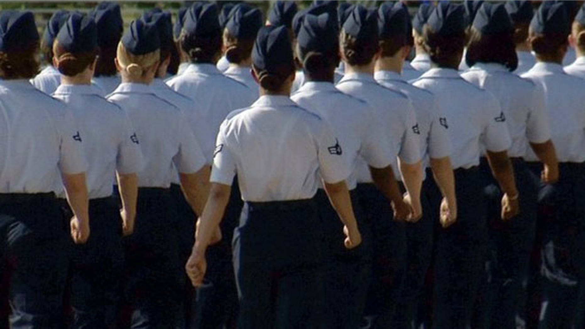 In this June 22, 2012, image made from video, female airmen march during graduation at Lackland Air Force Base in San Antonio.