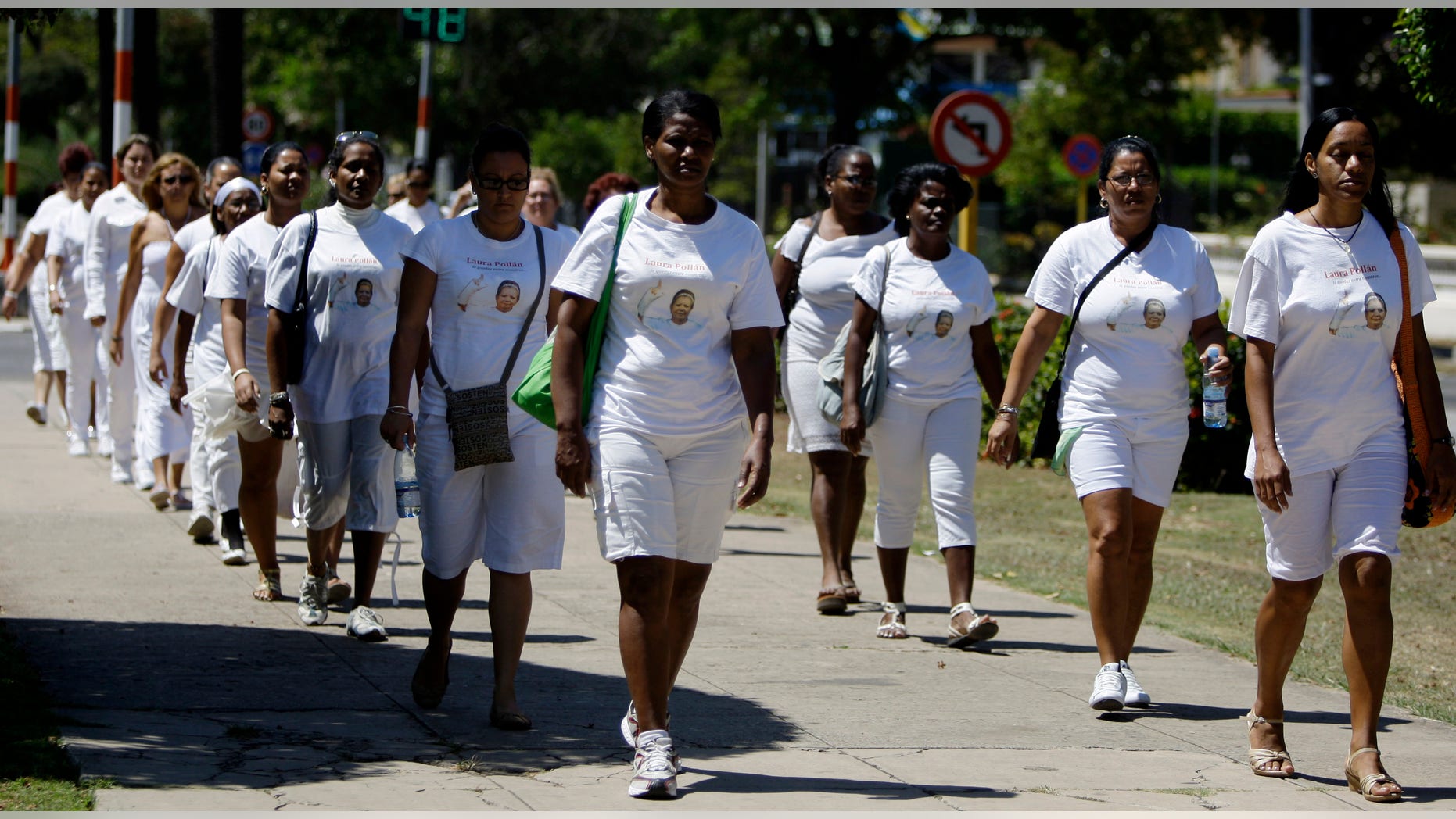 Members of dissident group Ladies in White take part in their weekly march in front of Santa Rita church in Havana, Cuba, Sunday March 18, 2012. (AP Photo/Franklin Reyes)