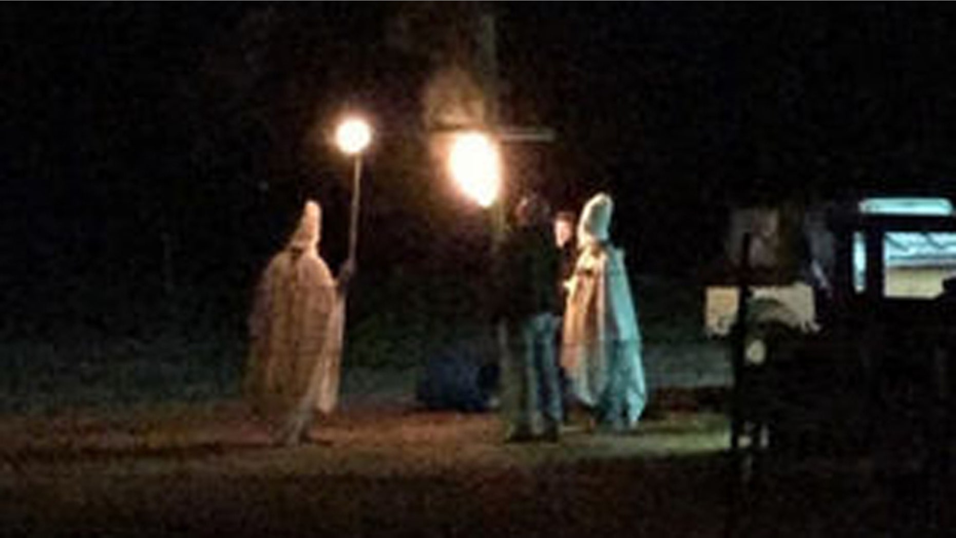 Oct. 31, 2015: This photo shows a group of people taking part in a mock Ku Klux Klan rally in Lahoma, Okla. The husband of Lahoma's mayor has since apologized for taking part in what authorities dubbed a 'Halloween prank gone wrong'. (Facebook)