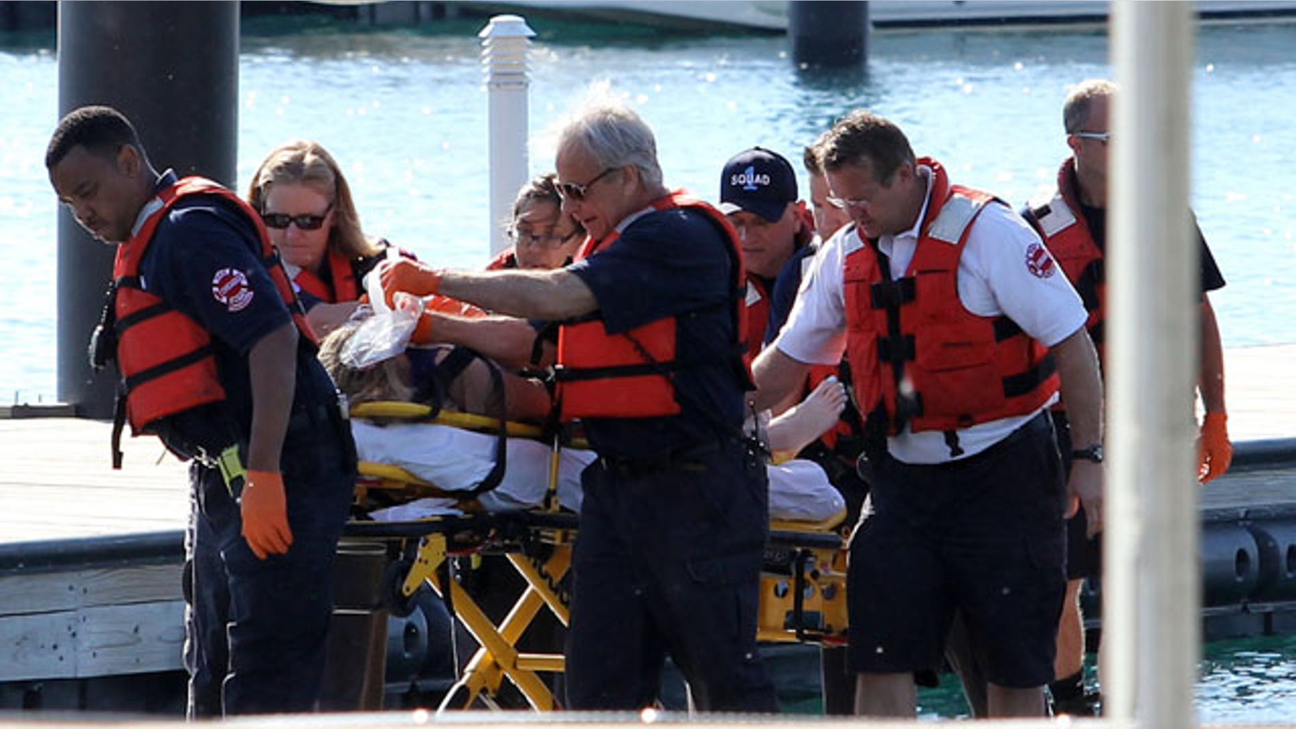 June 1, 2014: A woman is rescued from the South Side stretch of Lake Michigan after a boat she was in capsized Saturday night miles from Chicago's shoreline. The woman was later pronounced dead at a local hospital. The U.S. Coast Guard said crews are searching for as many as four other people. (AP Photo/Sun-Times Media, Alex Wroblewski)