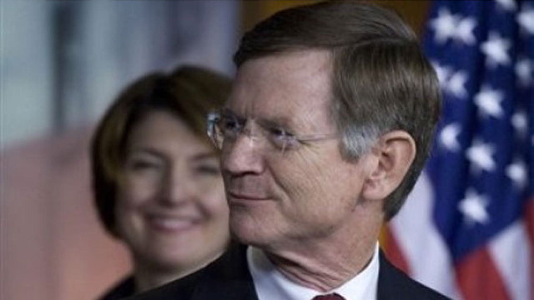 May 26, 2011: Rep. Lamar Smith, R-Texas, right, accompanied by Rep. Cathy McMorris Rodgers, R-Wash. smiles during a news conference on Capitol Hill in Washington.