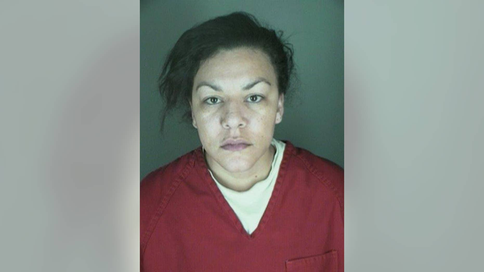 This undated booking photo provided by the Longmont Police Department shows Dynel Lyne, 34, who is accused of stabbing a pregnant woman in the stomach and removing her baby, while the expectant mother visited her home to buy baby clothes advertised on Craigslist authorities said. The 26-year-old expectant mother was found beaten and stabbed at the suspect's home, has undergone surgery, and on Thursday was alert, police said. The baby did not survive. (AP Photo/ Longmont Police Department)